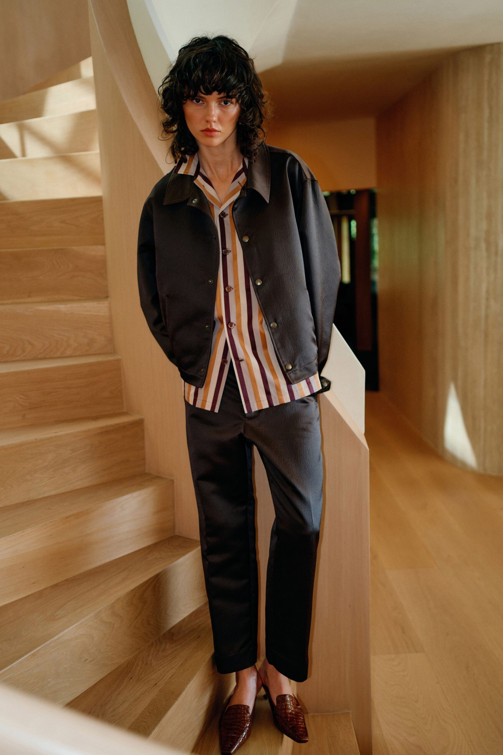 black jacket with striped shirt and pants