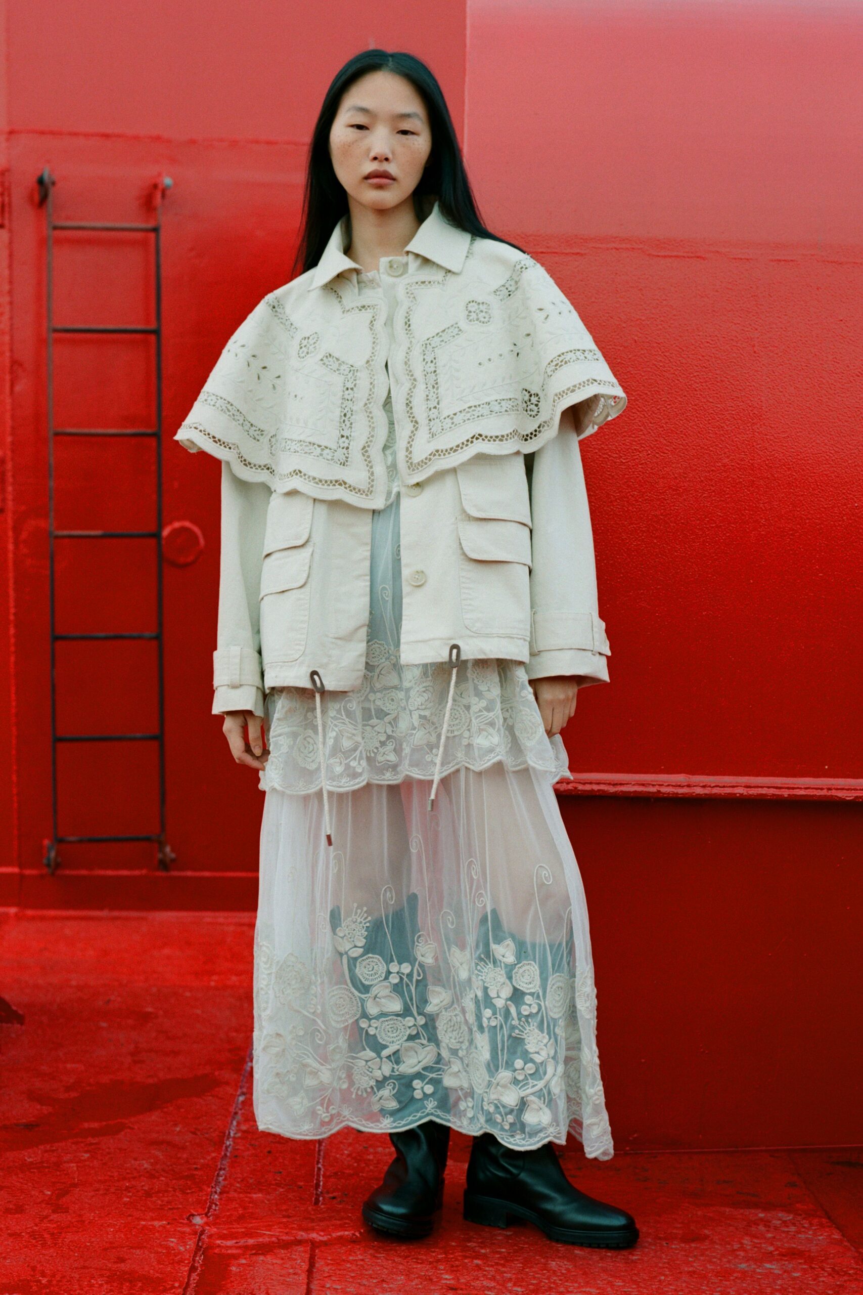 beige embroidered jacket with white lace dress
