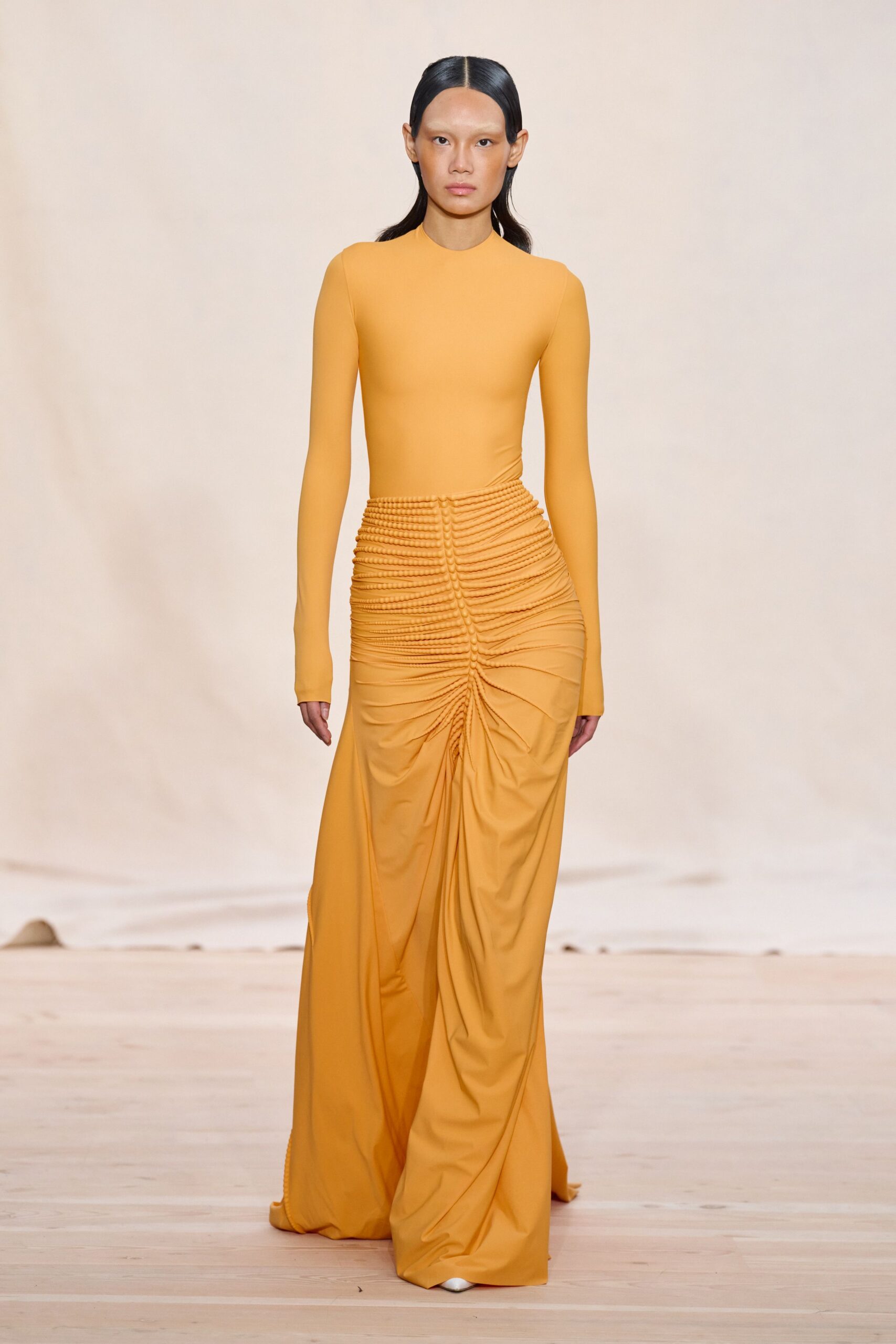 fitted yellow long-sleeve gown