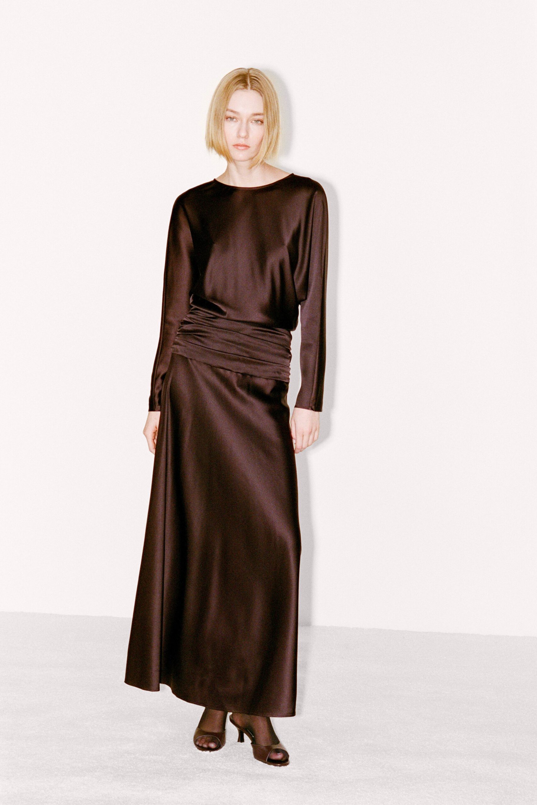 black silk long-sleeve collared fitted ruched shiny gown