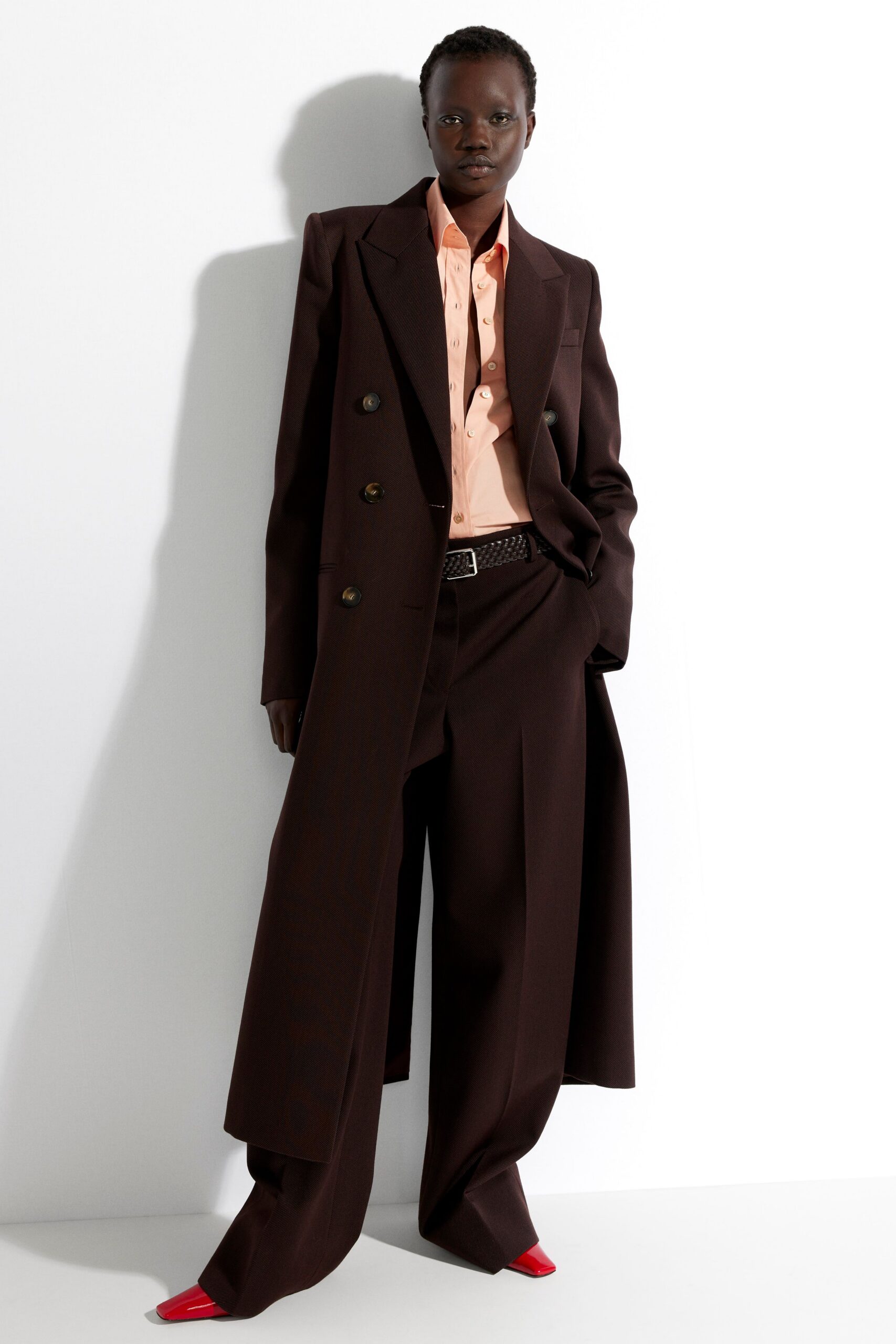 brown tailored blazer with peach shirt