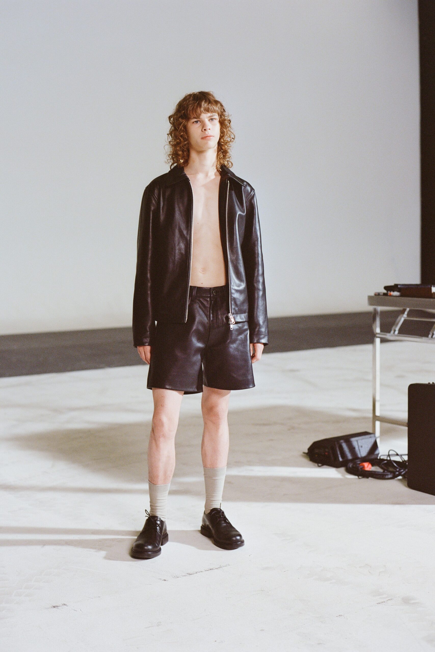 black leather jacket and shorts