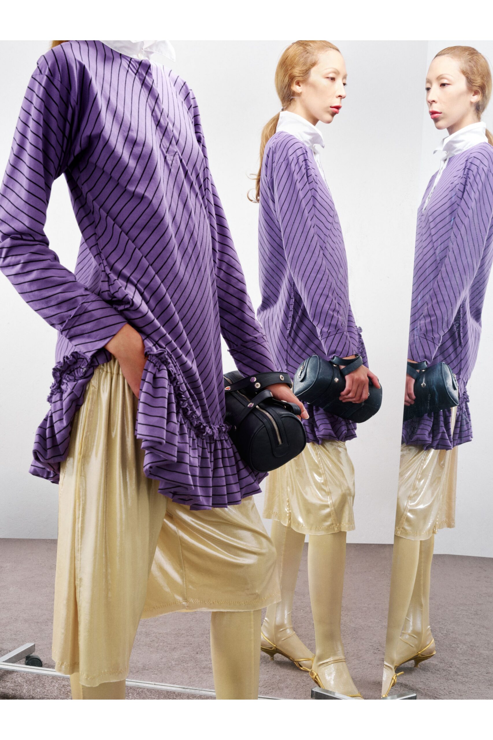 purple striped top with gold pants