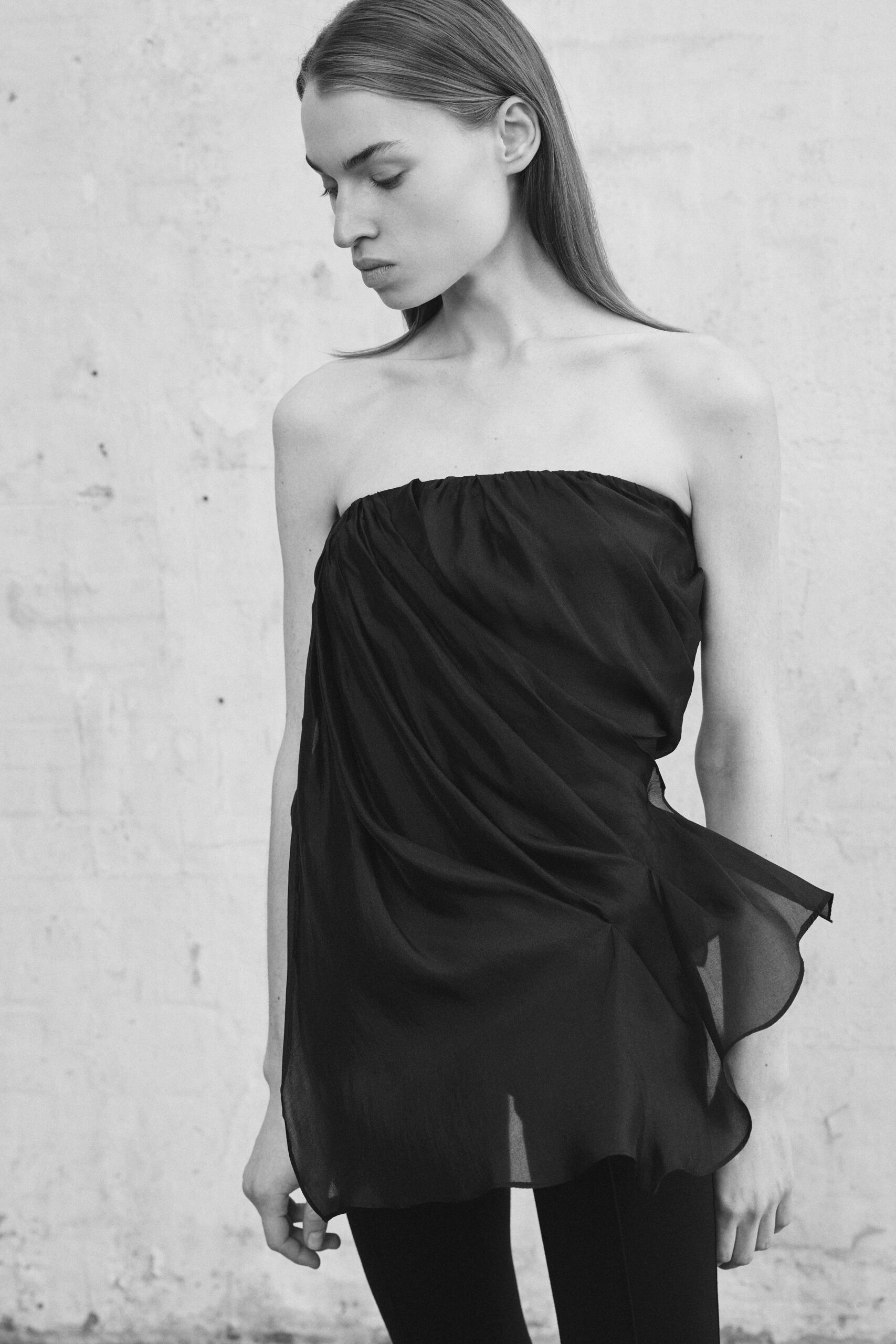 black chiffon strapless fitted draped flowing top