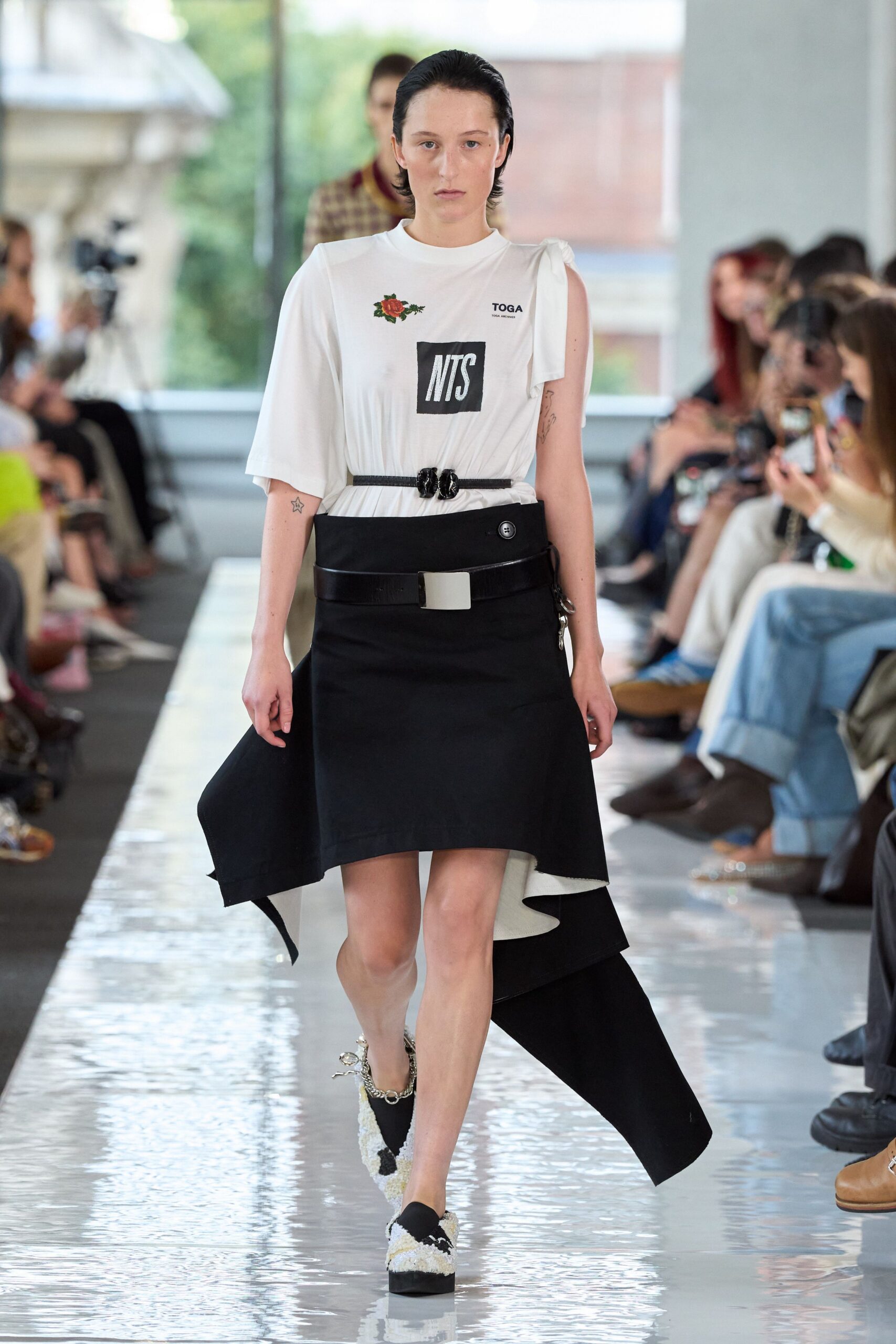 white relaxed top with black skirt