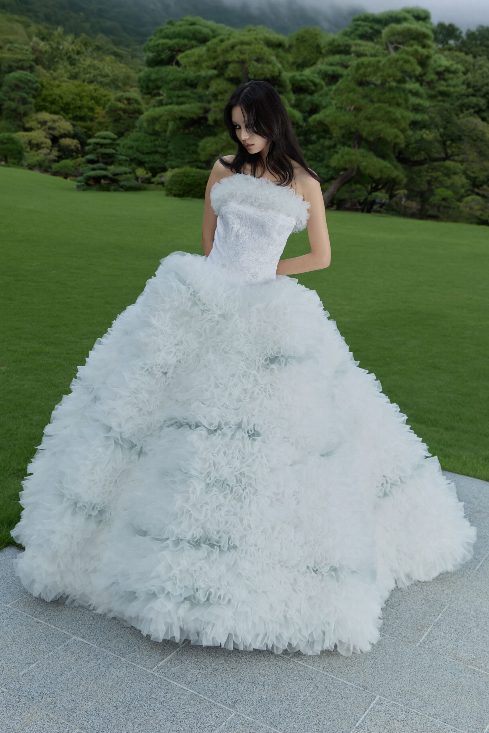 white ruffled strapless gown