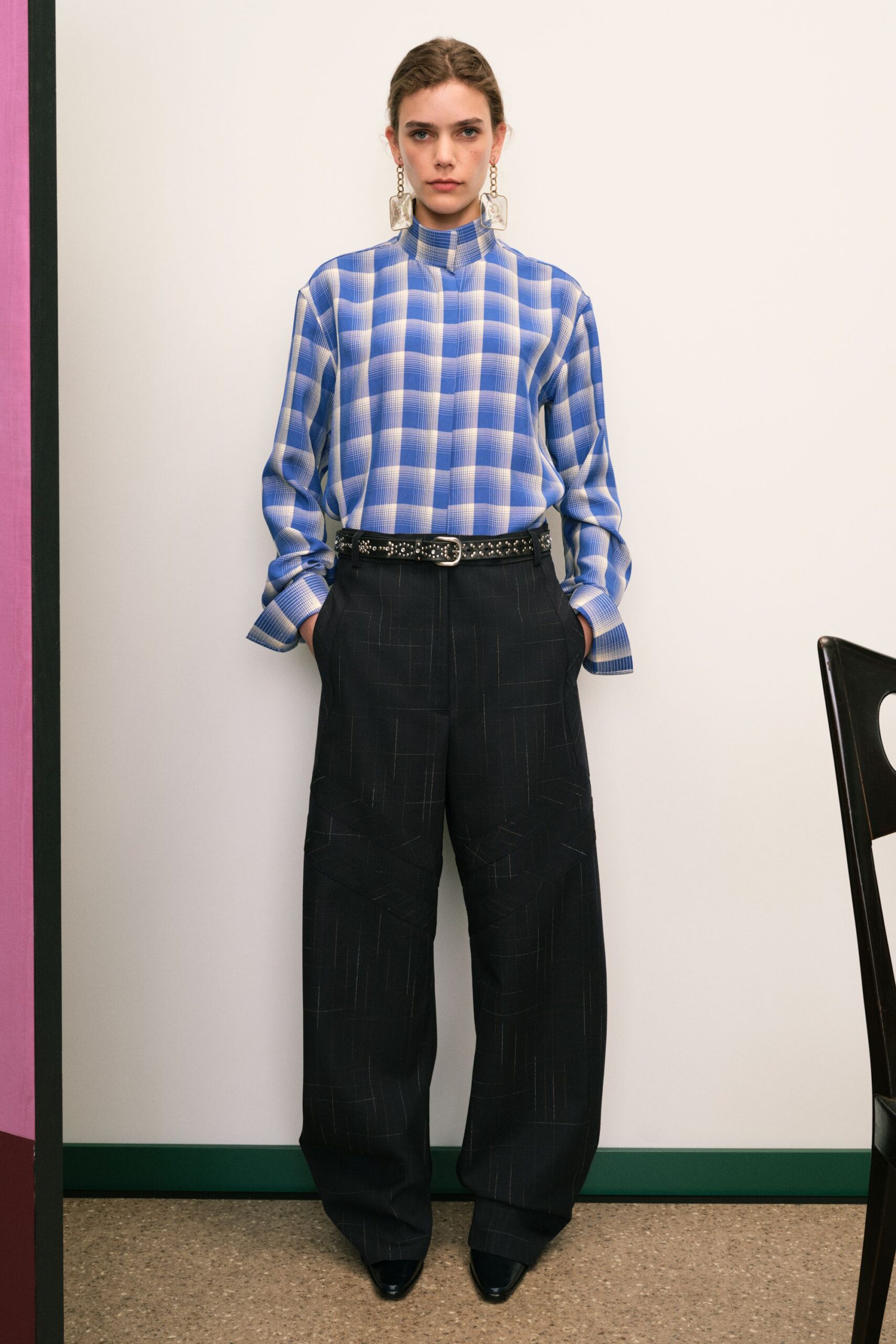 blue checked shirt and black pants