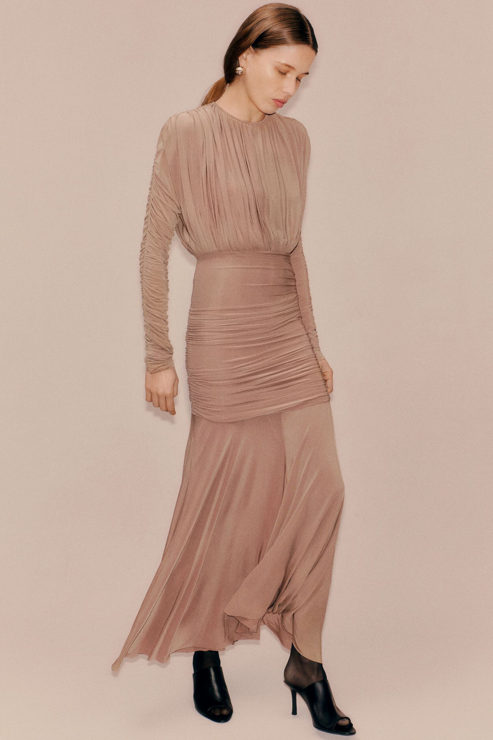 beige silk fitted gown with black shoes