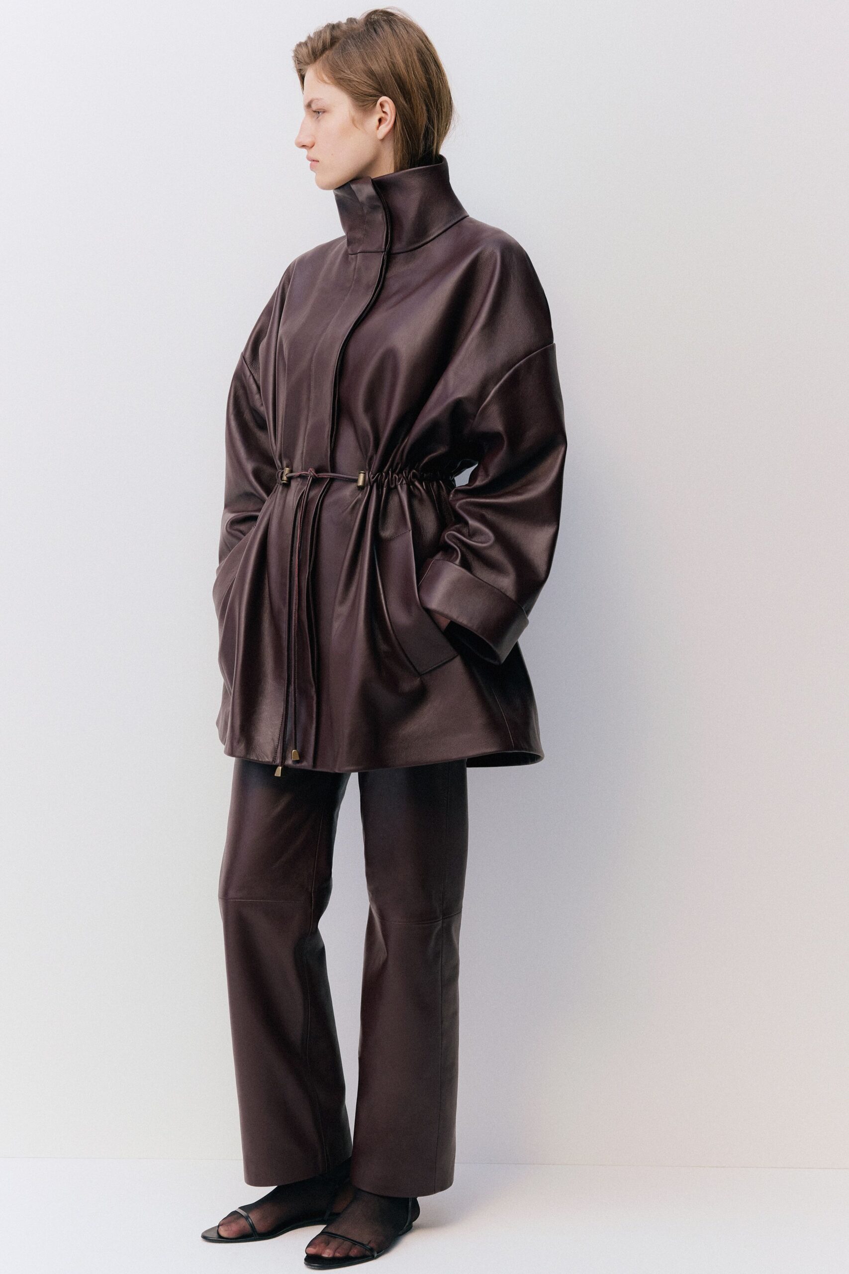 brown leather long-sleeve high-neck oversized zippered belted jacket
