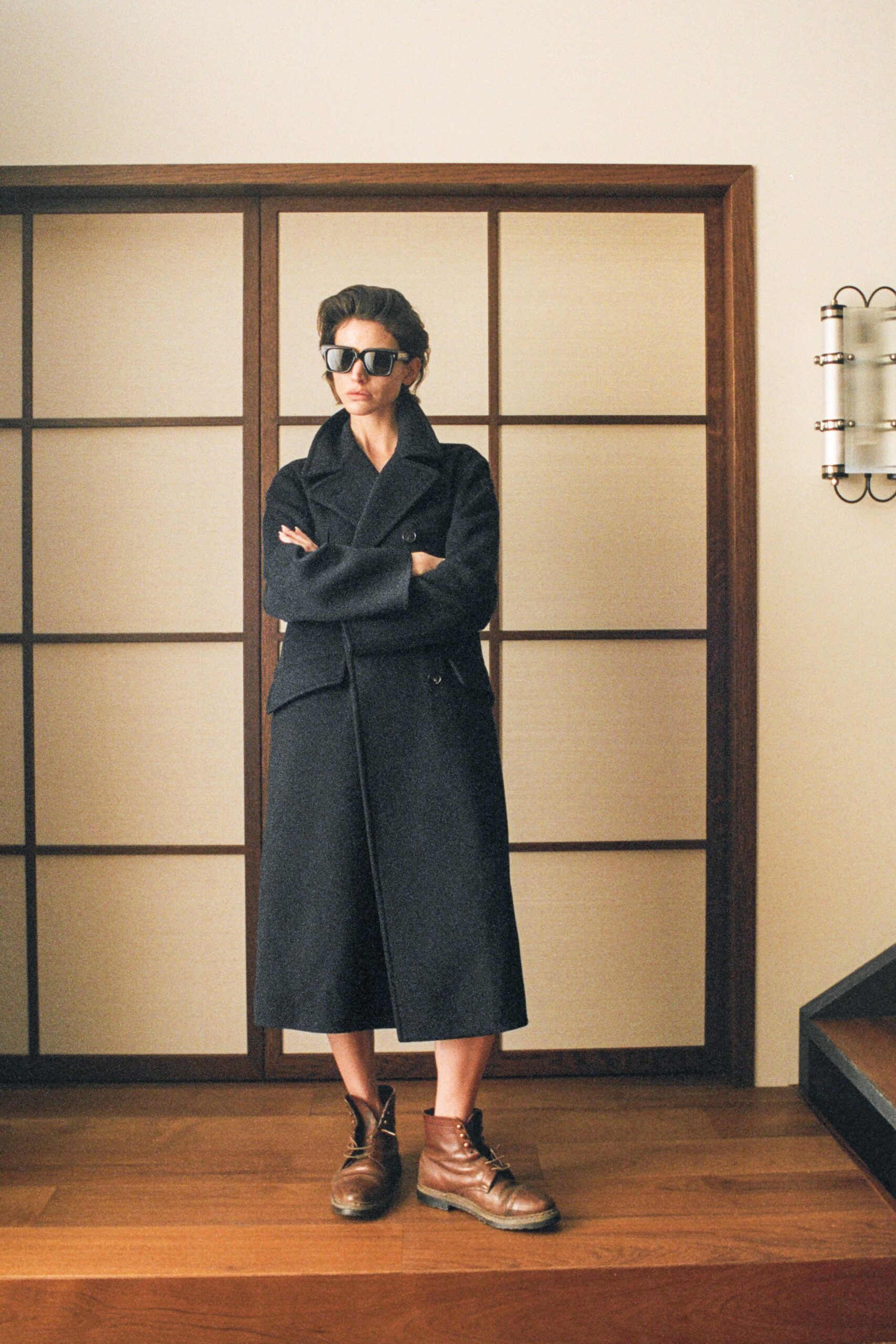 black wool coat with brown shoes