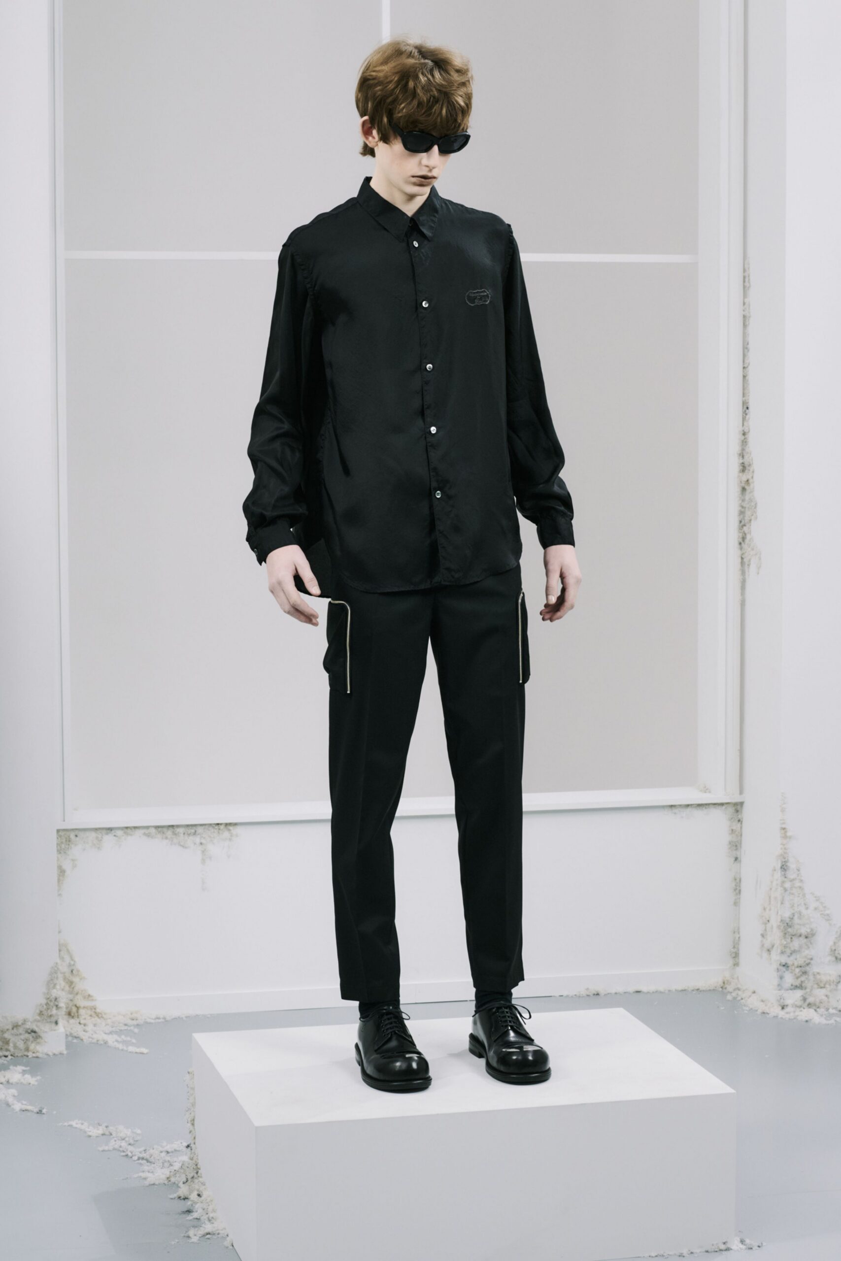 black silk shirt and tailored pants
