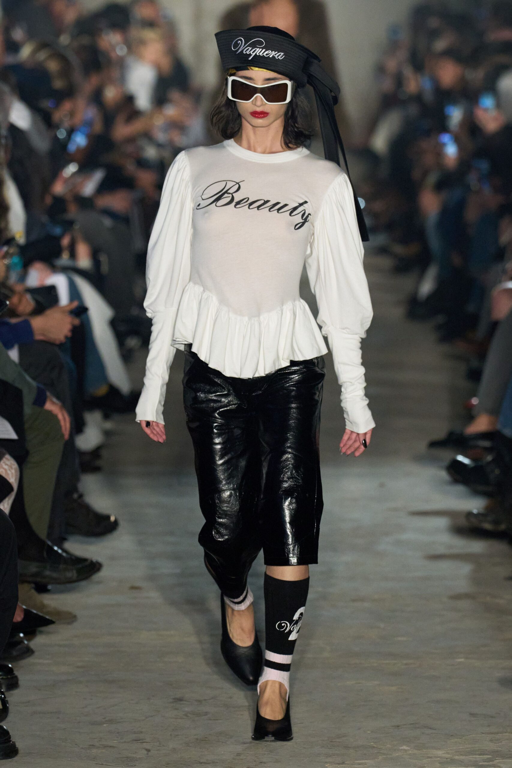 white ruffled top and black pants