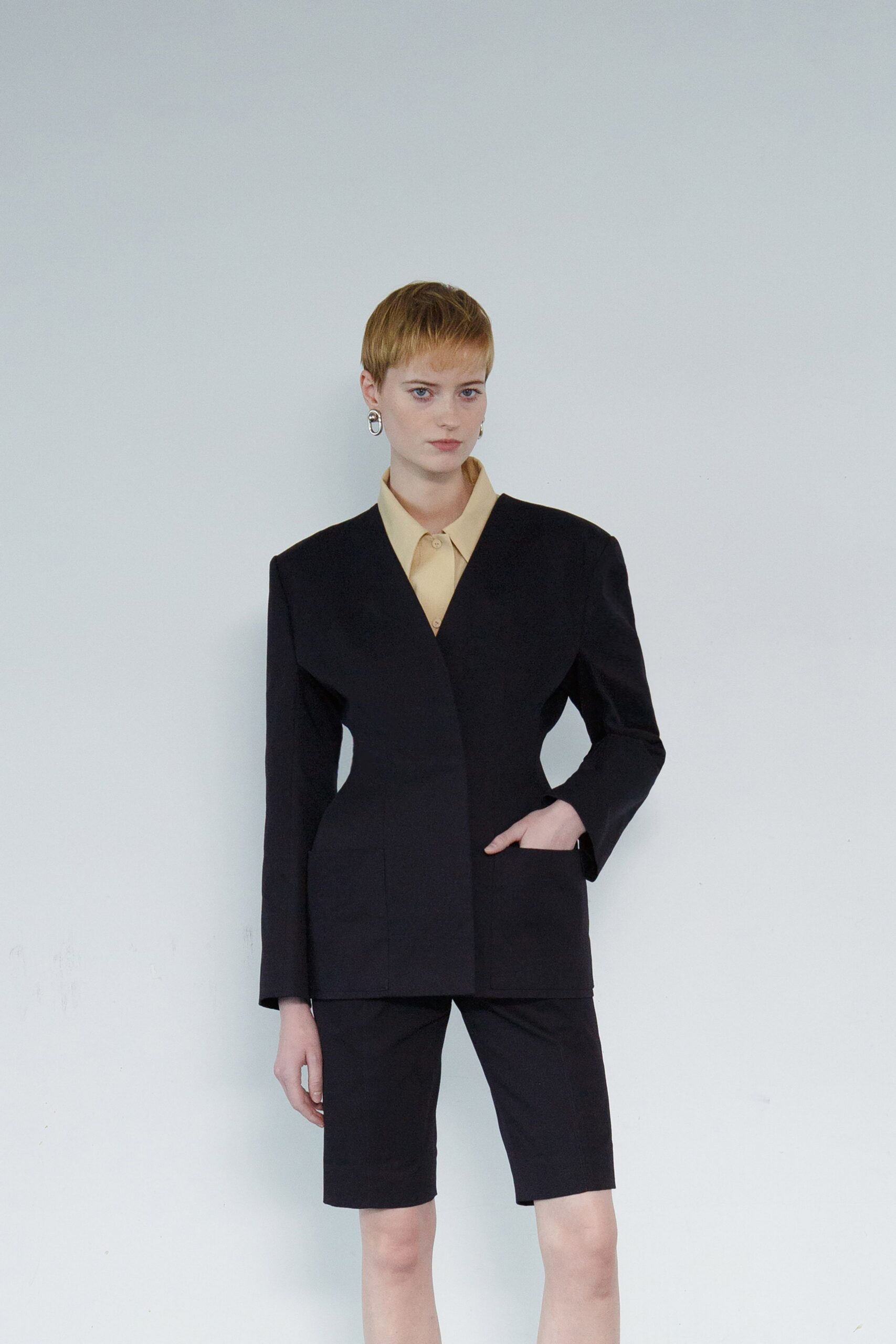 black cotton long-sleeve collared structured buttoned blazer