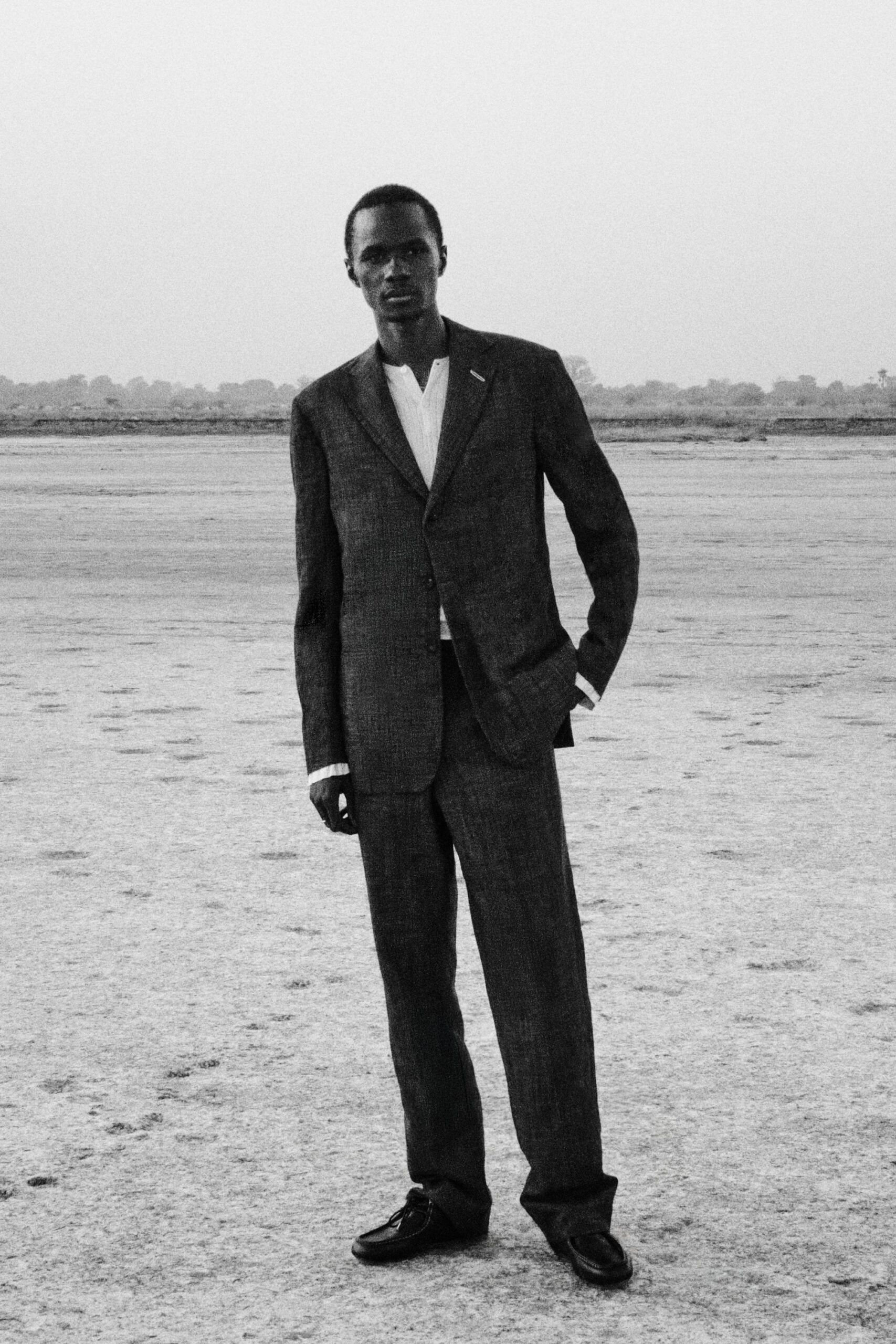 black wool long-sleeve collared tailored buttoned suit