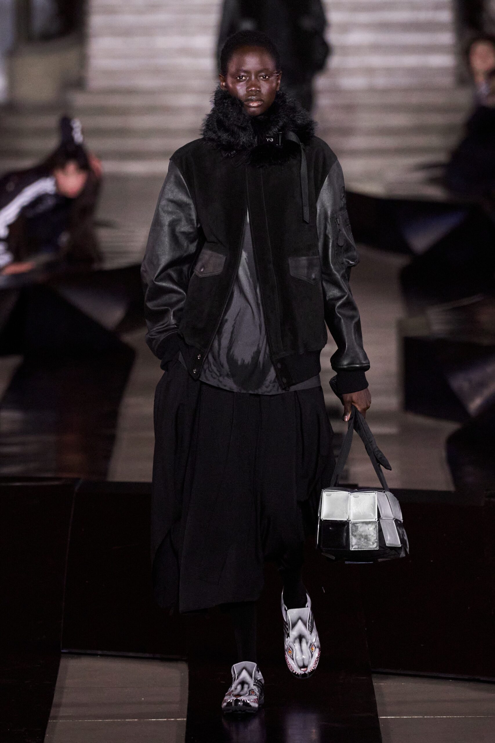 black leather jacket with pleated skirt