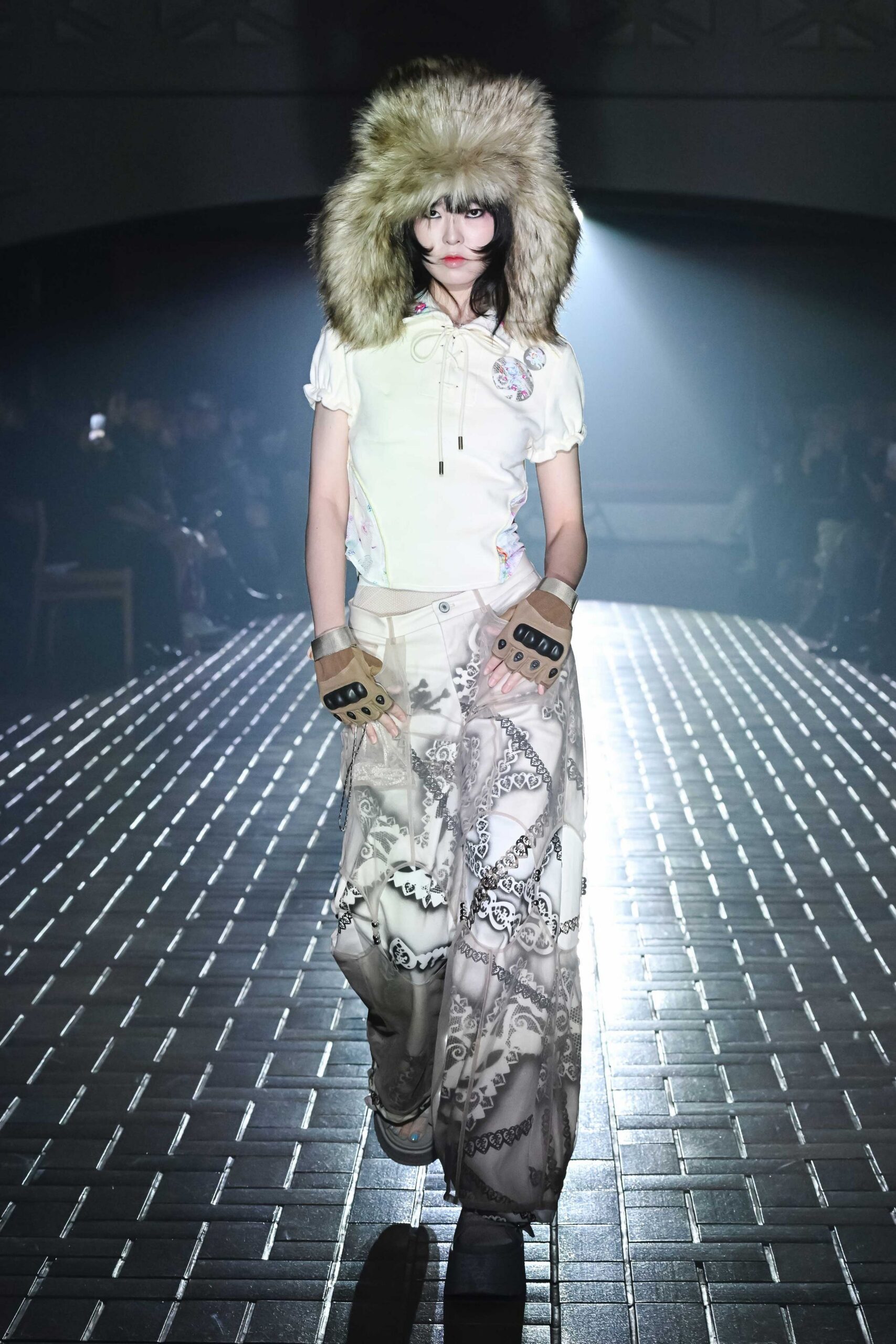 white fitted top with beige printed pants