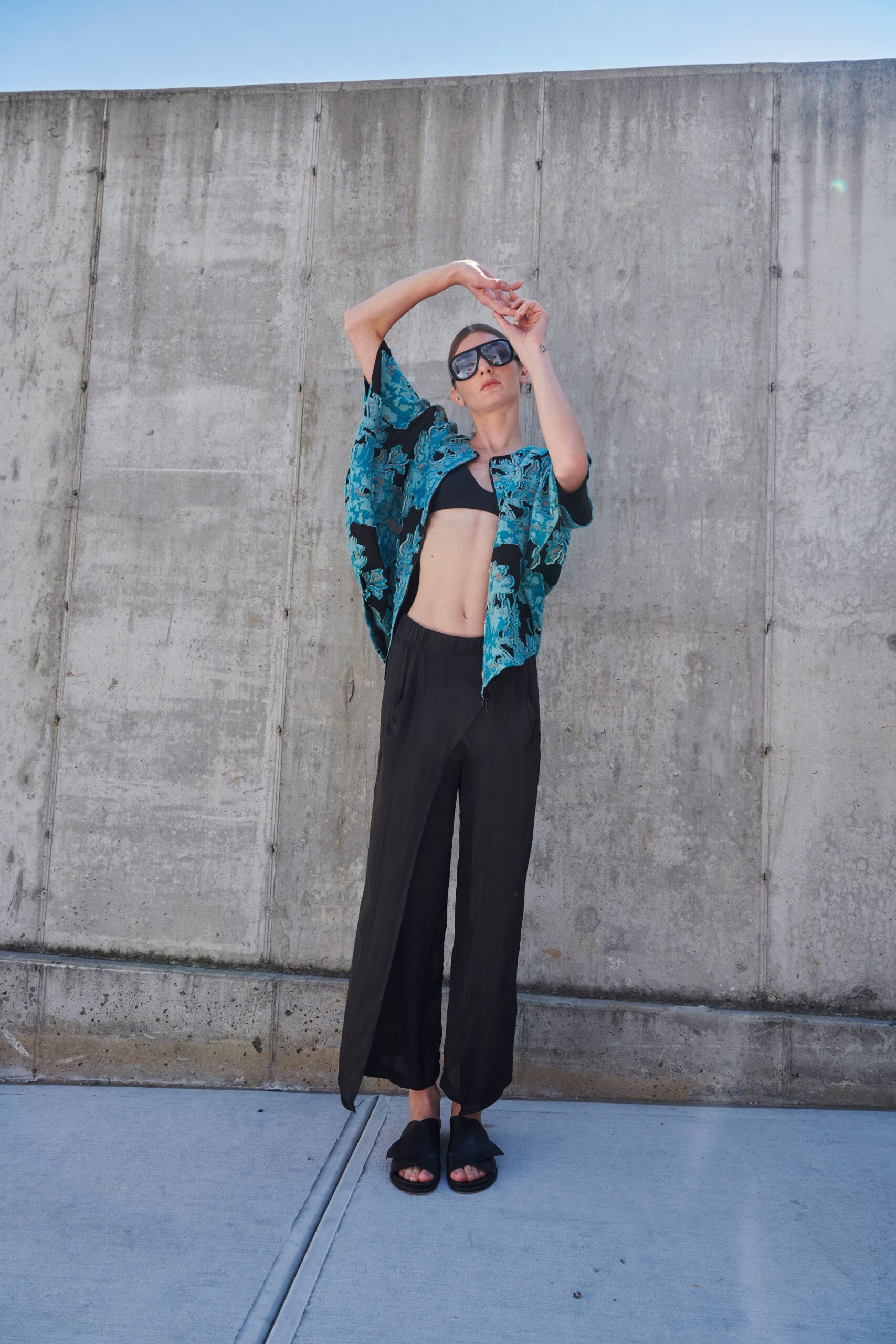 blue floral top with black pants