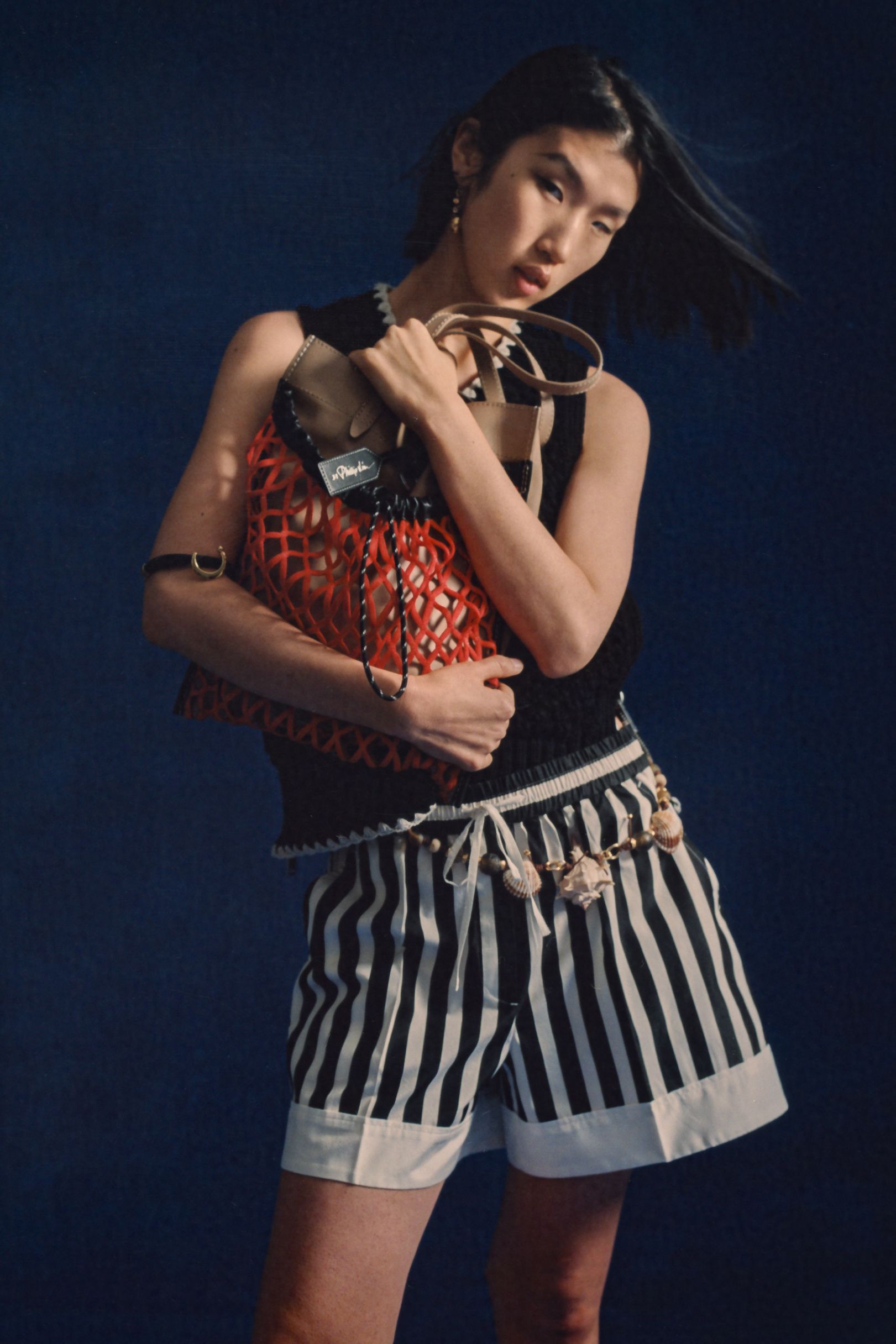 black fitted top with striped shorts