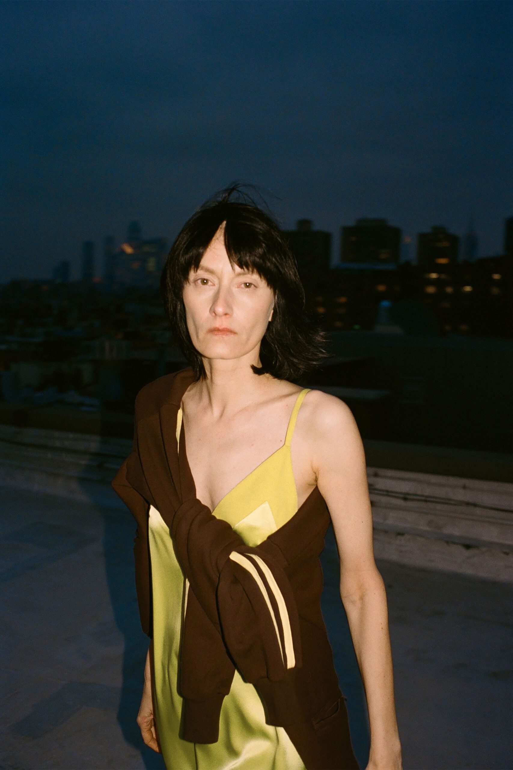 yellow silk midi dress with brown jacket