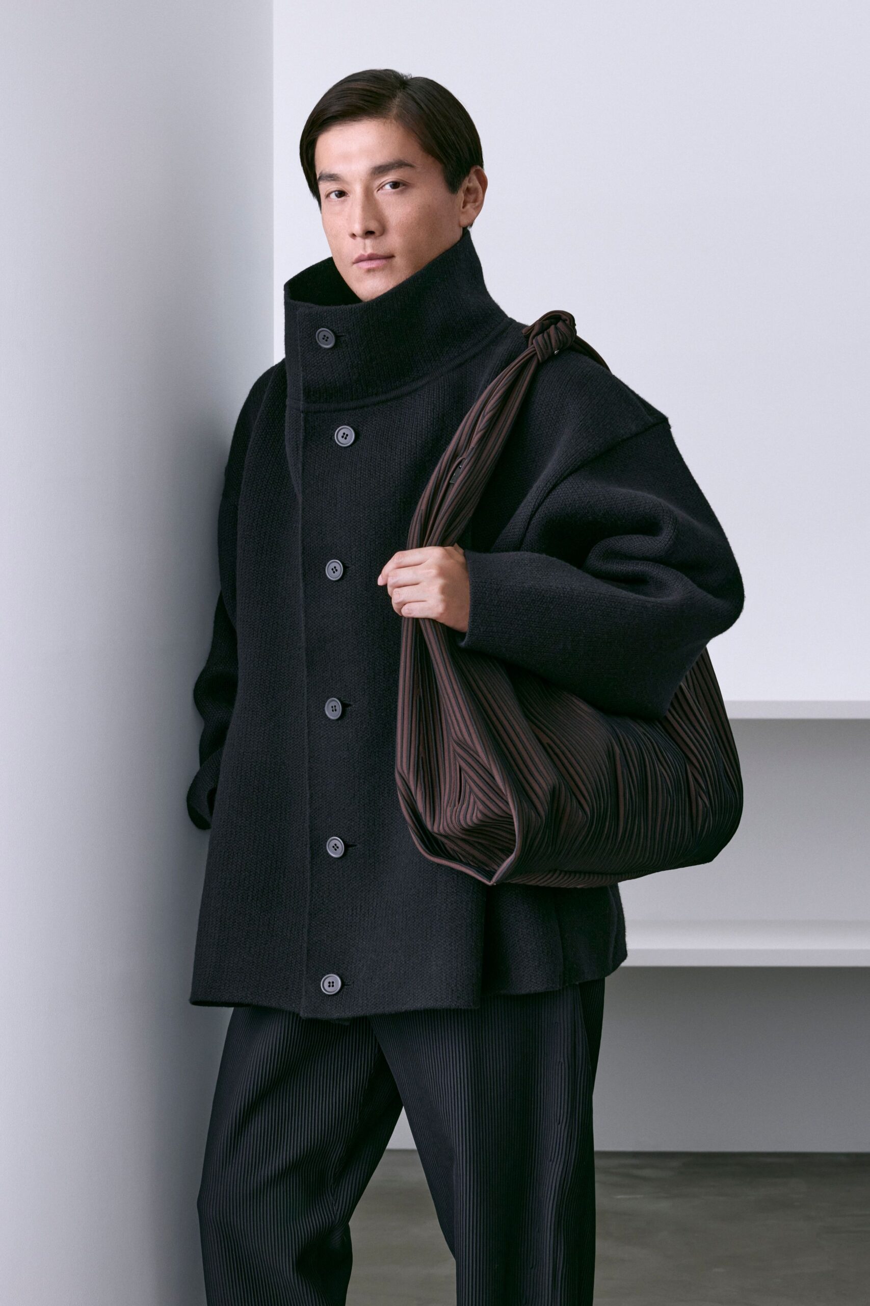 black oversized coat with brown bag