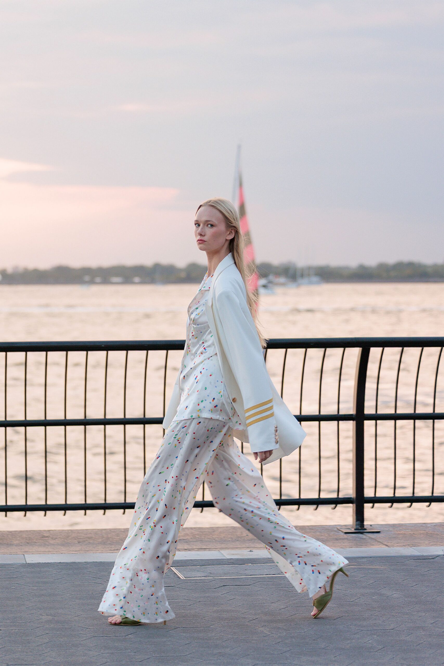 white silk sleeveless v-neck fitted flared flowing jumpsuit
