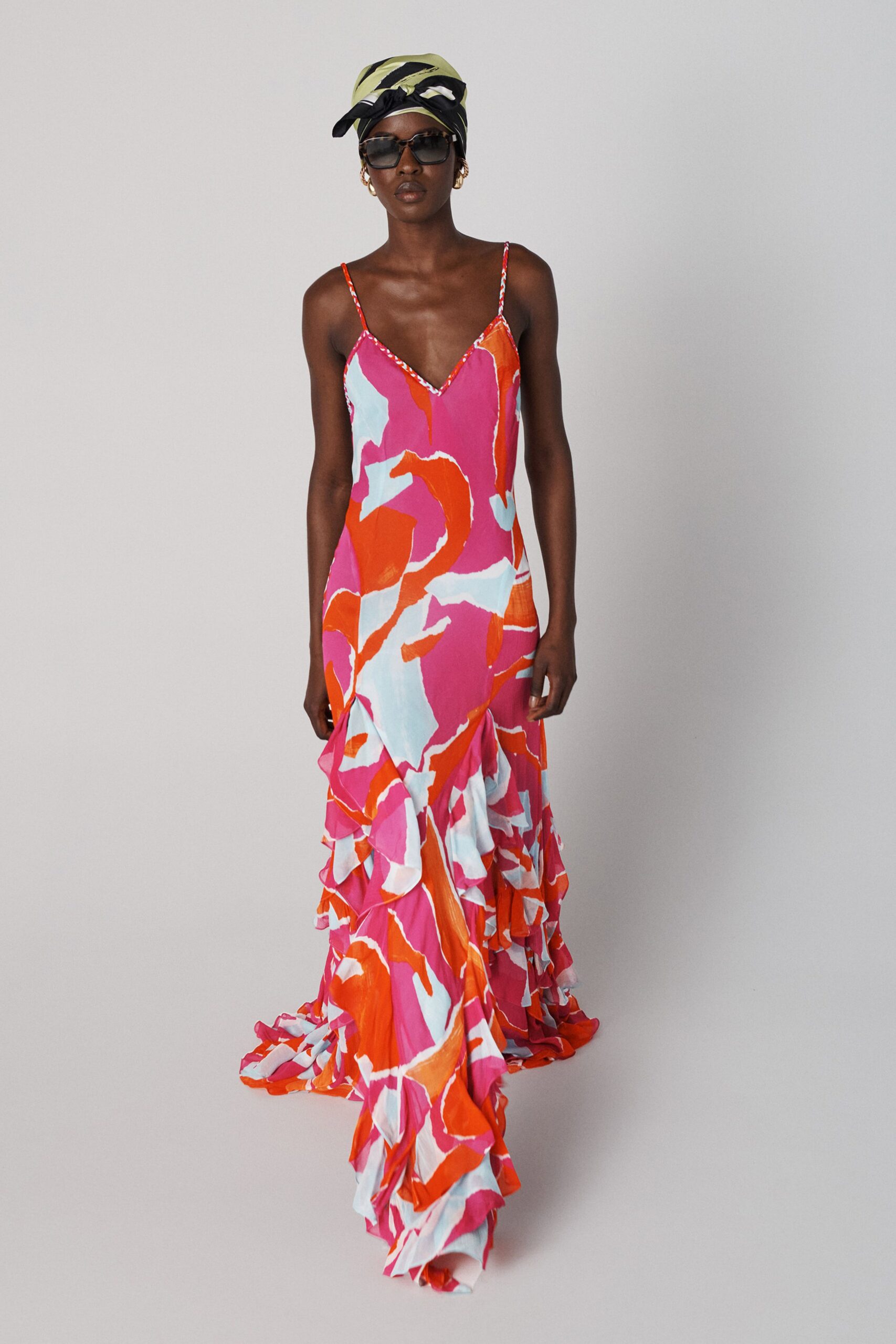 pink silk sleeveless v-neck fitted ruffled flared gown