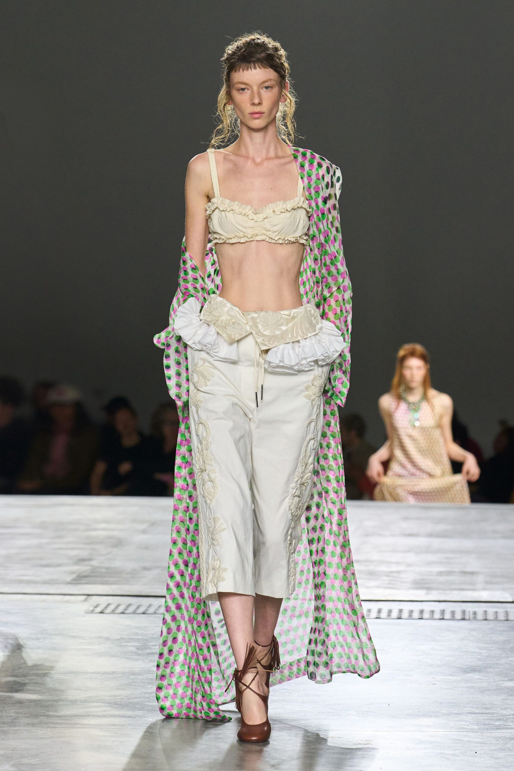 white ruffled top with cropped pants