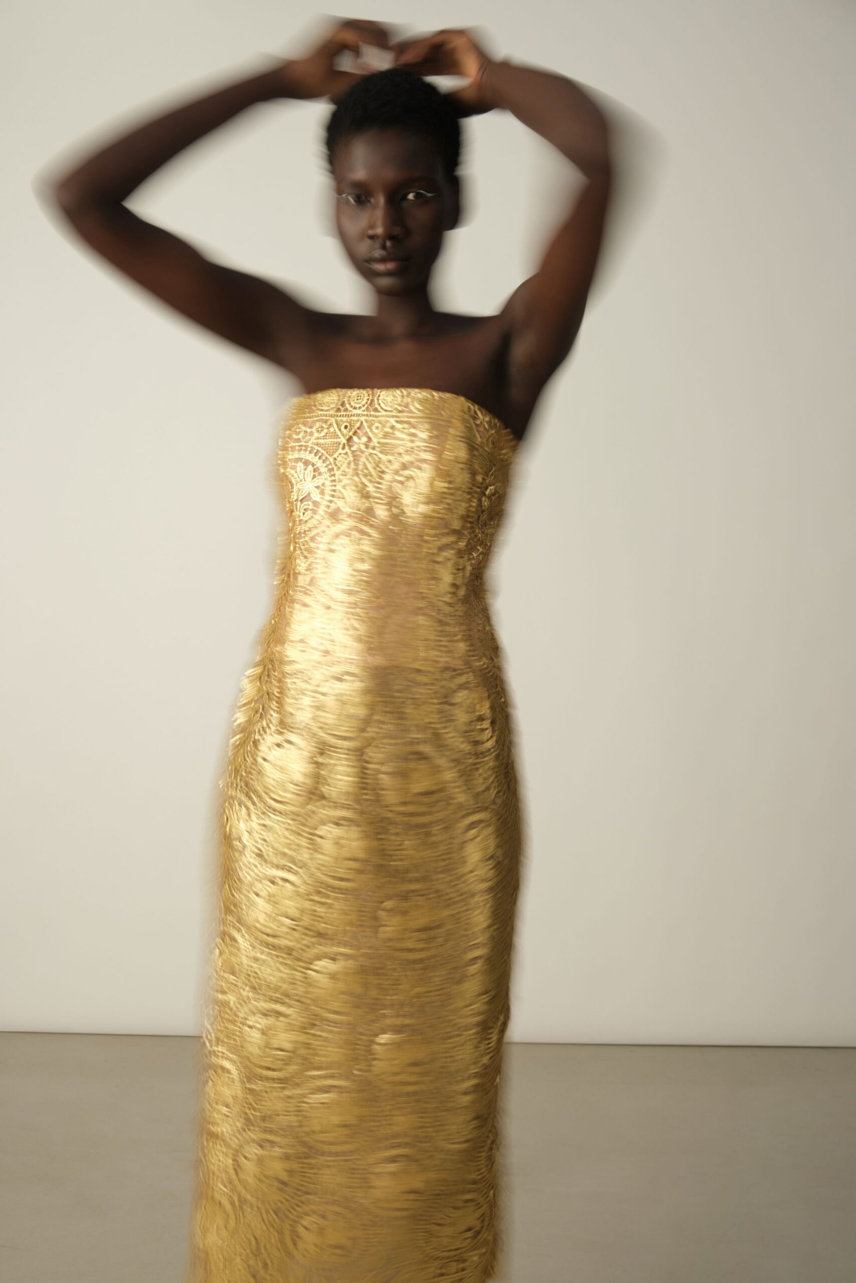 gold embroidered strapless gown