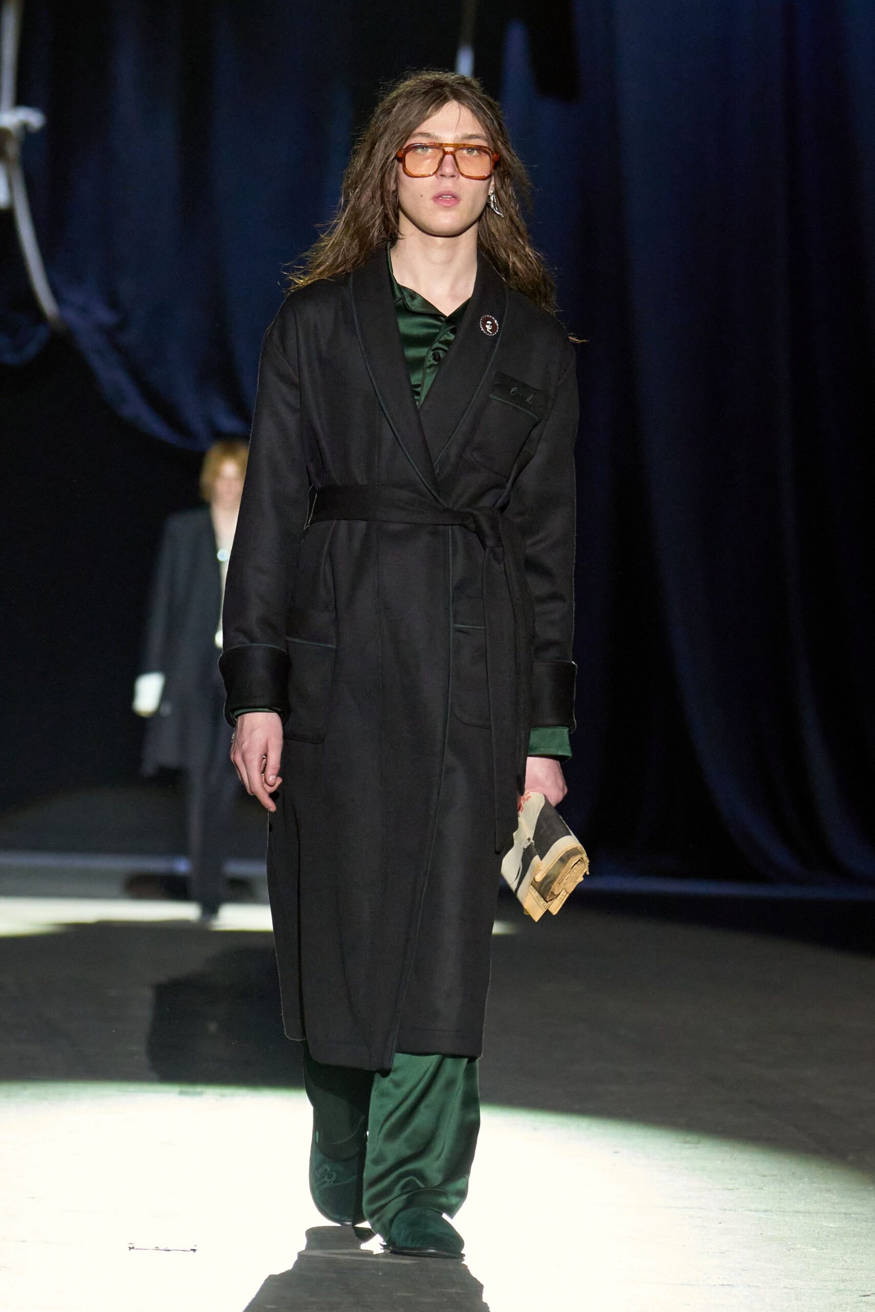 black coat green pants beige shoes