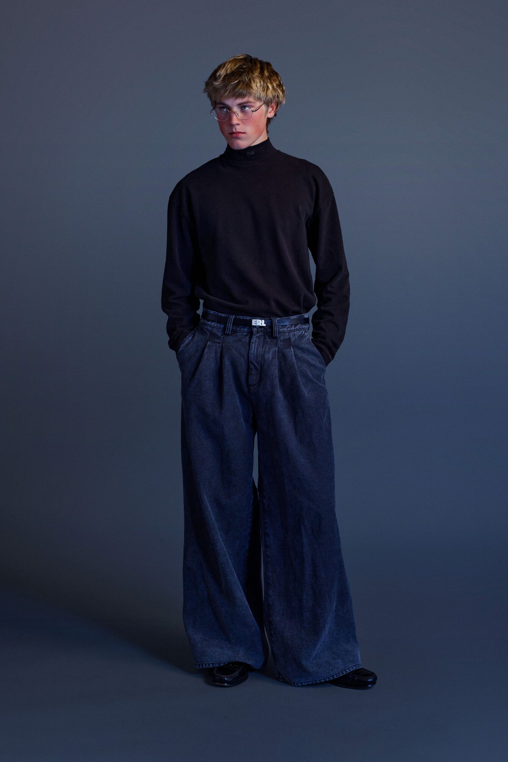 black turtleneck top with wide-leg jeans