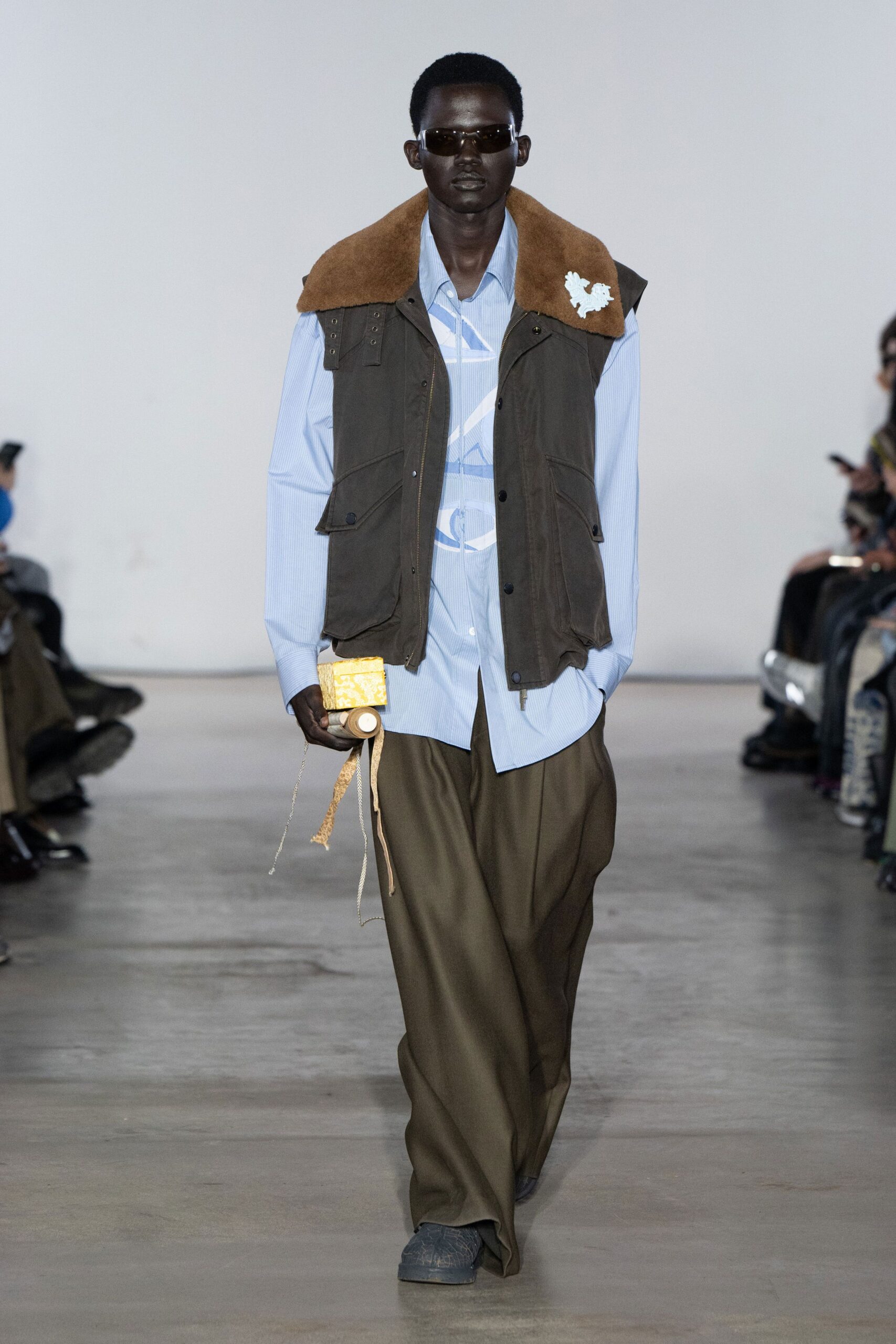 brown green layered jacket with blue shirt