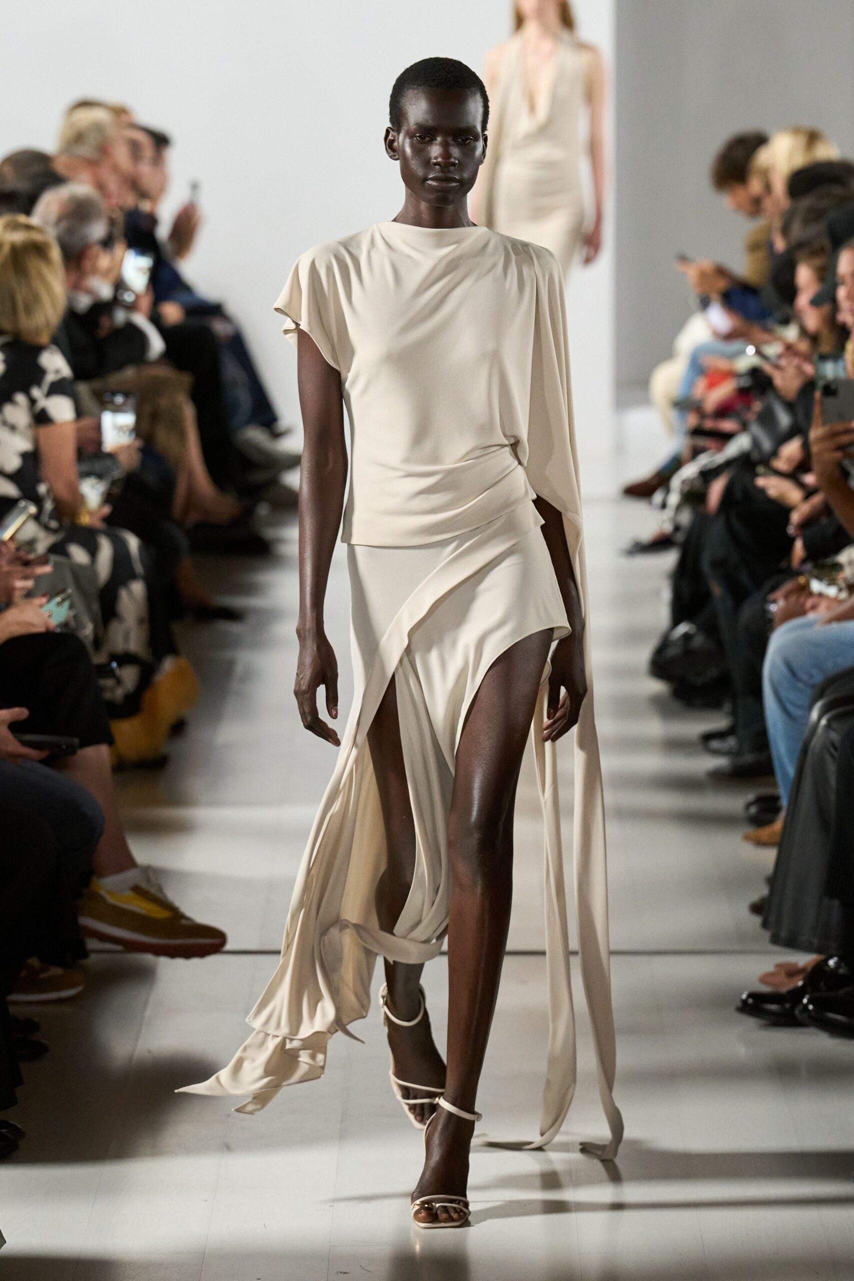beige silk sleeveless high-neck fitted draped flowing dress