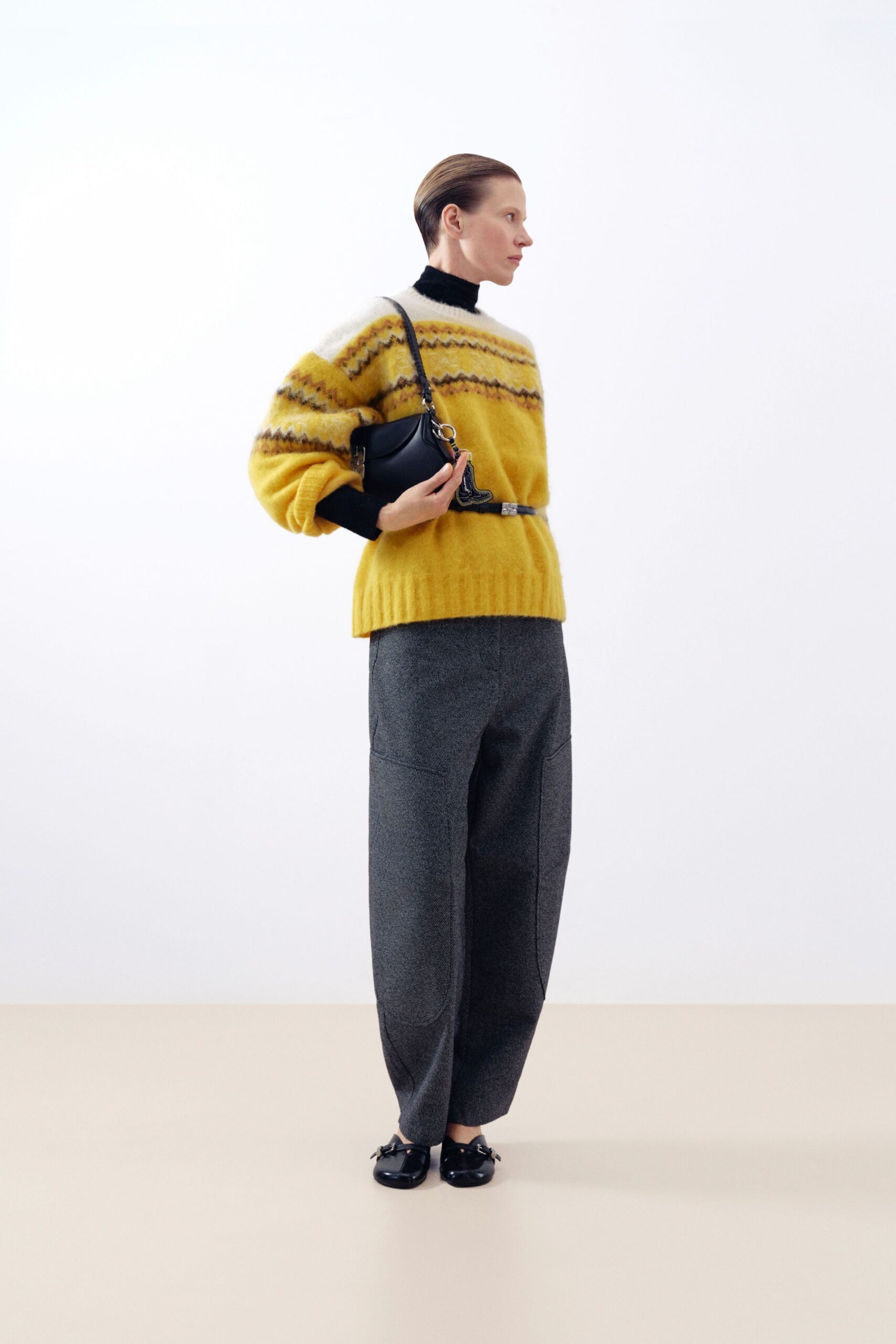 yellow striped sweater with gray pants