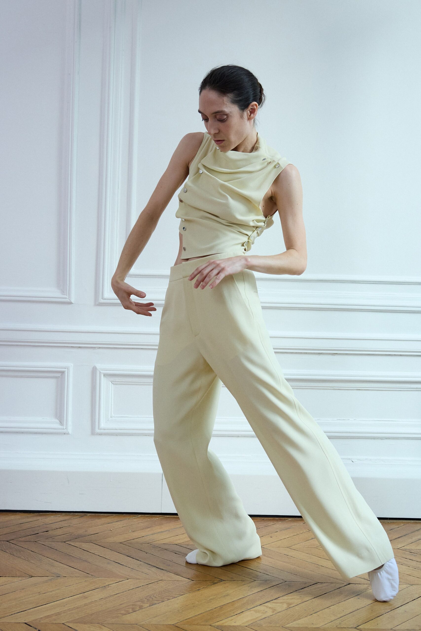 beige silk fitted top and relaxed pants