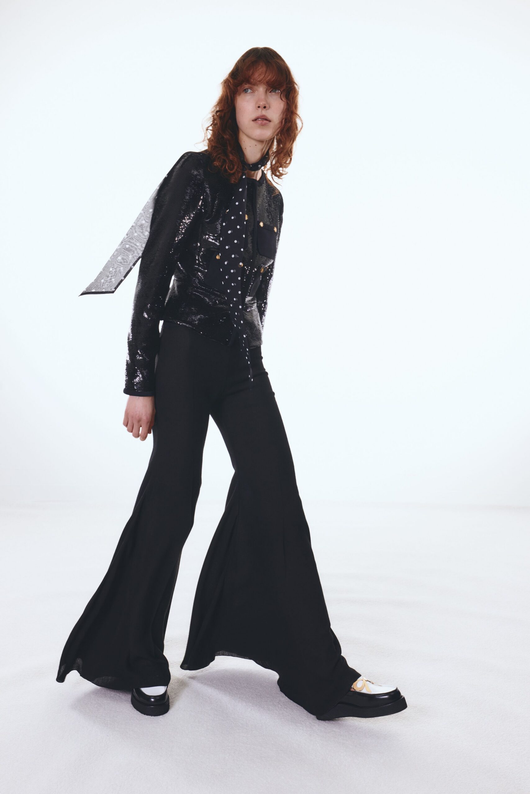 black sequined top with flared pants