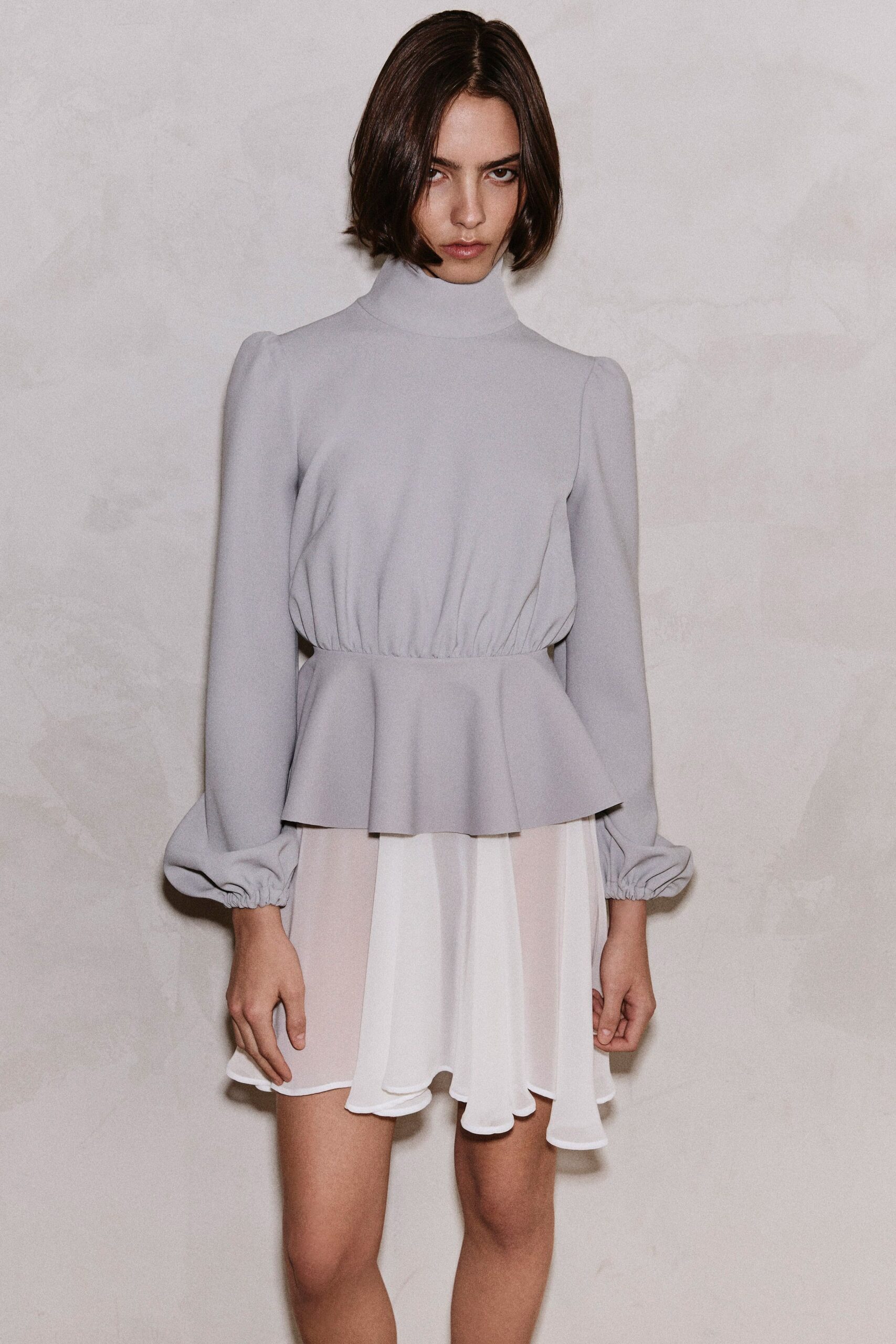 gray silk long-sleeve high-neck fitted flared top