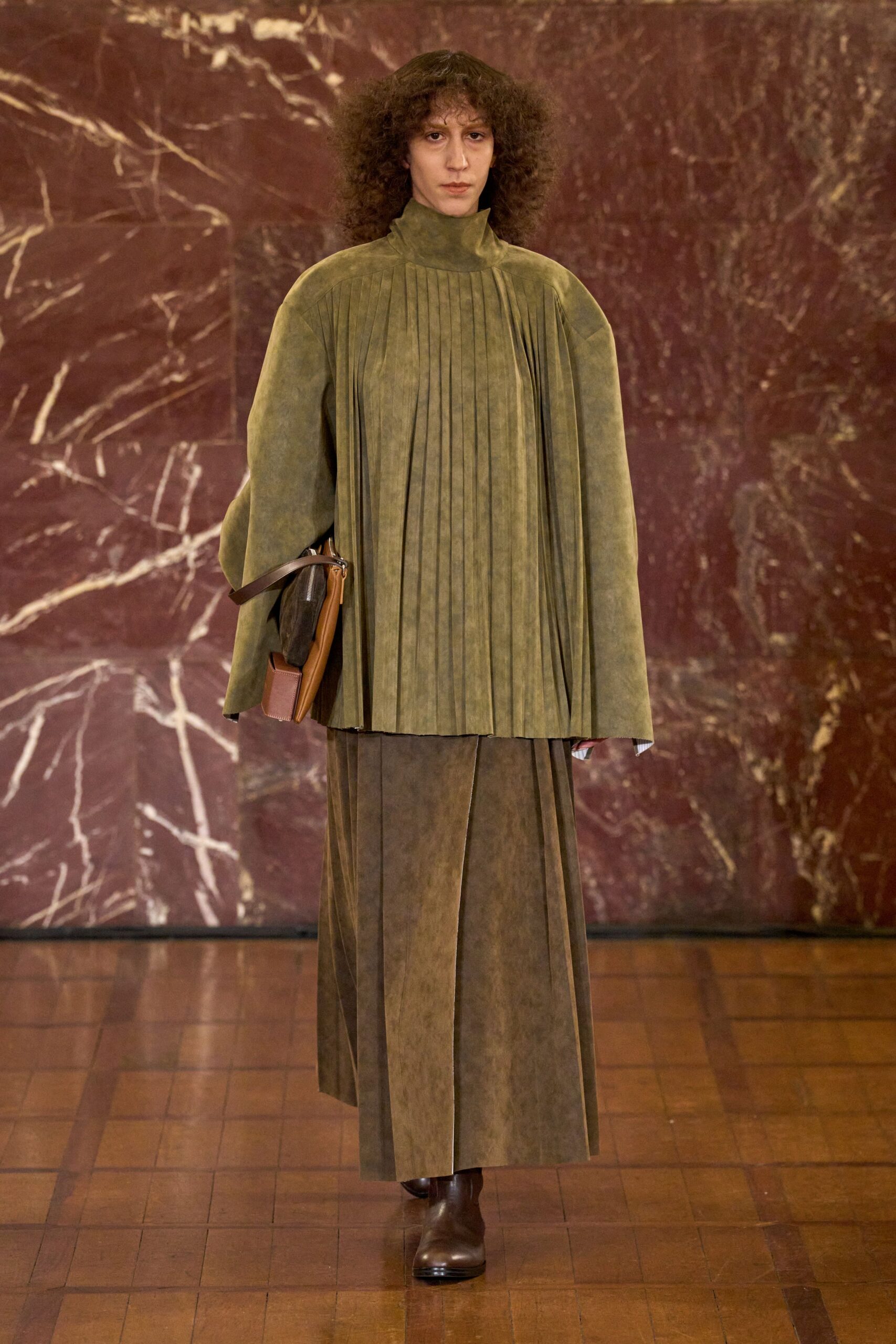 green pleated cape with midi skirt
