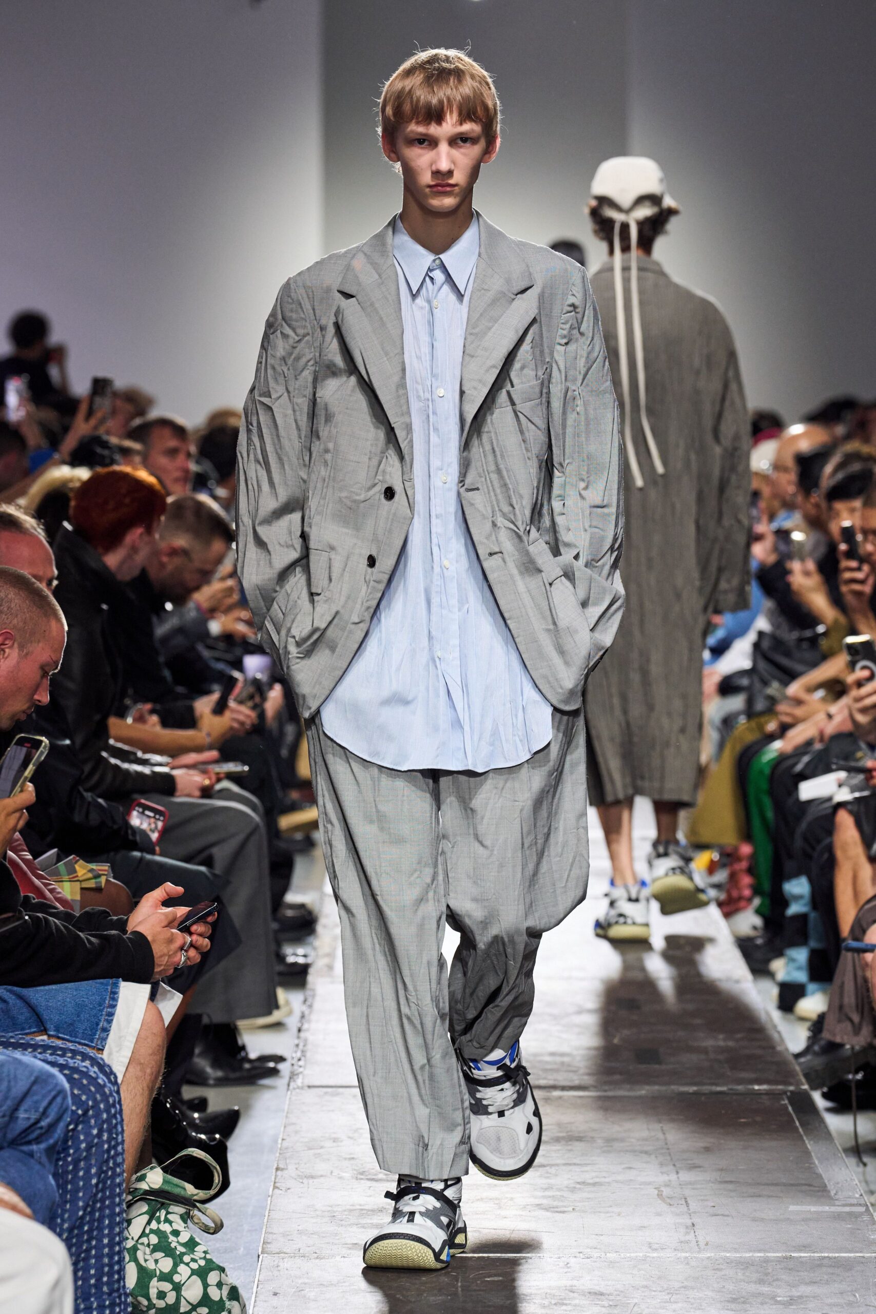 gray relaxed suit with blue shirt