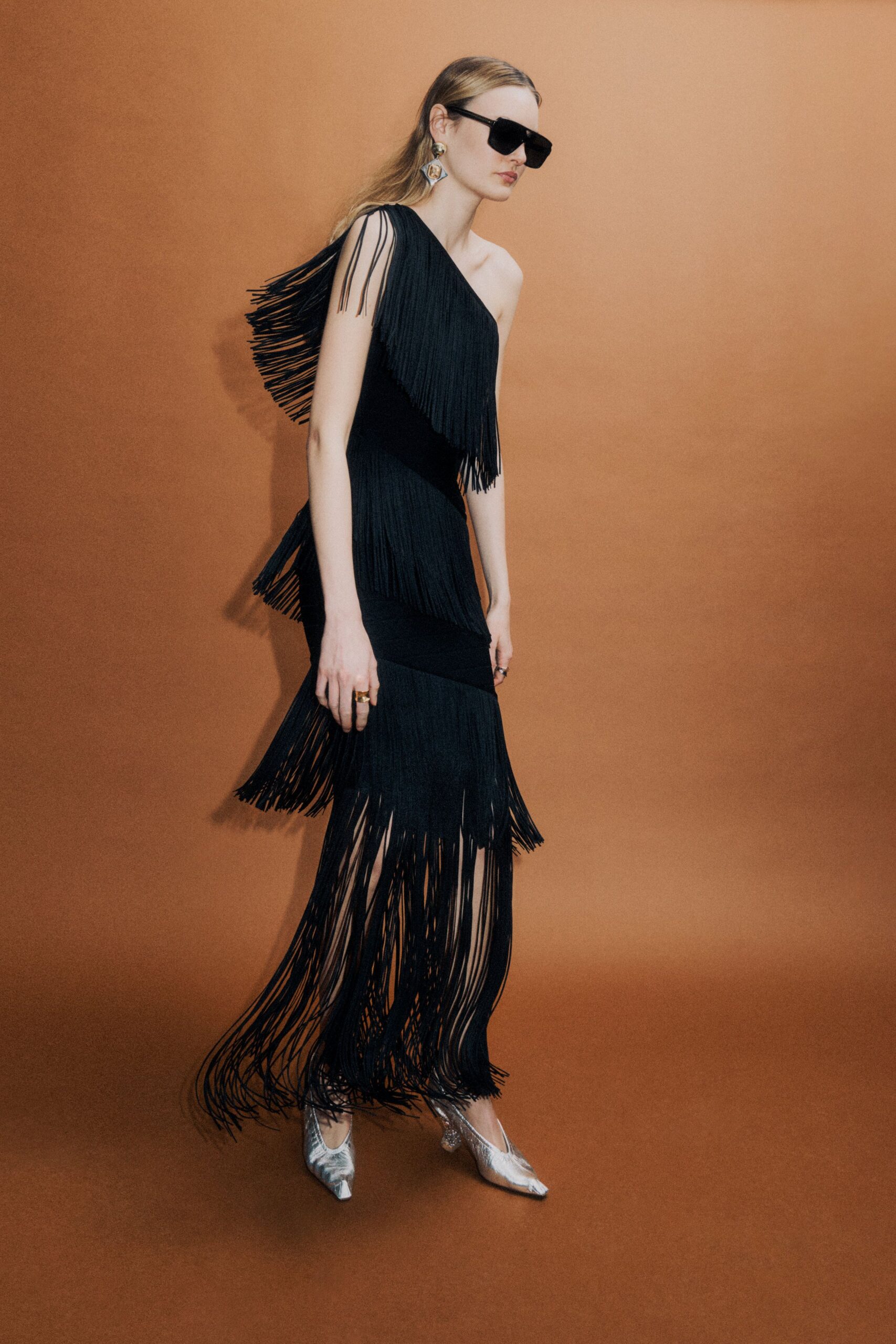 black fringed maxi dress with silver shoes