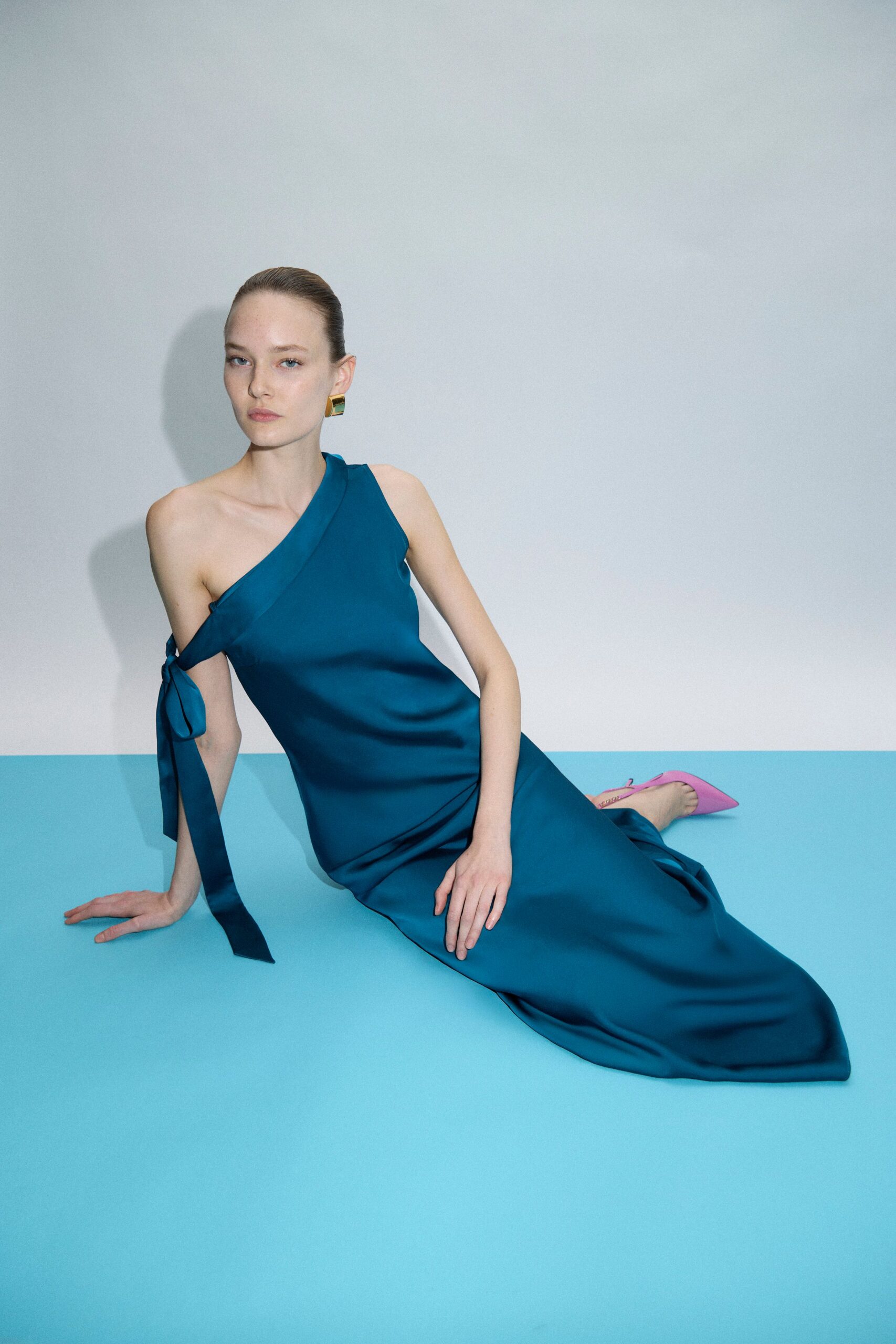 teal silk sleeveless high-neck fitted draped flowing gown