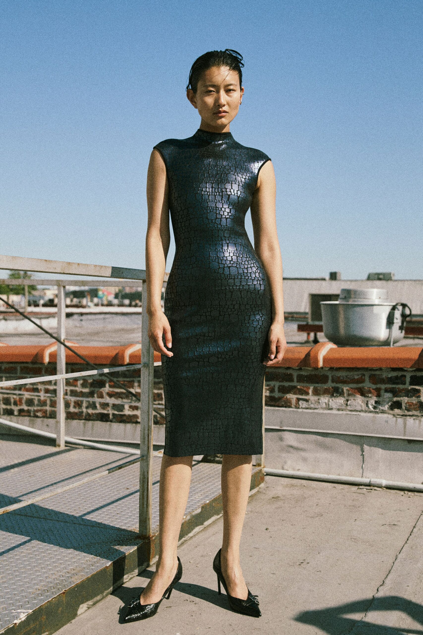 black vinyl short-sleeve high-neck fitted textured shiny dress