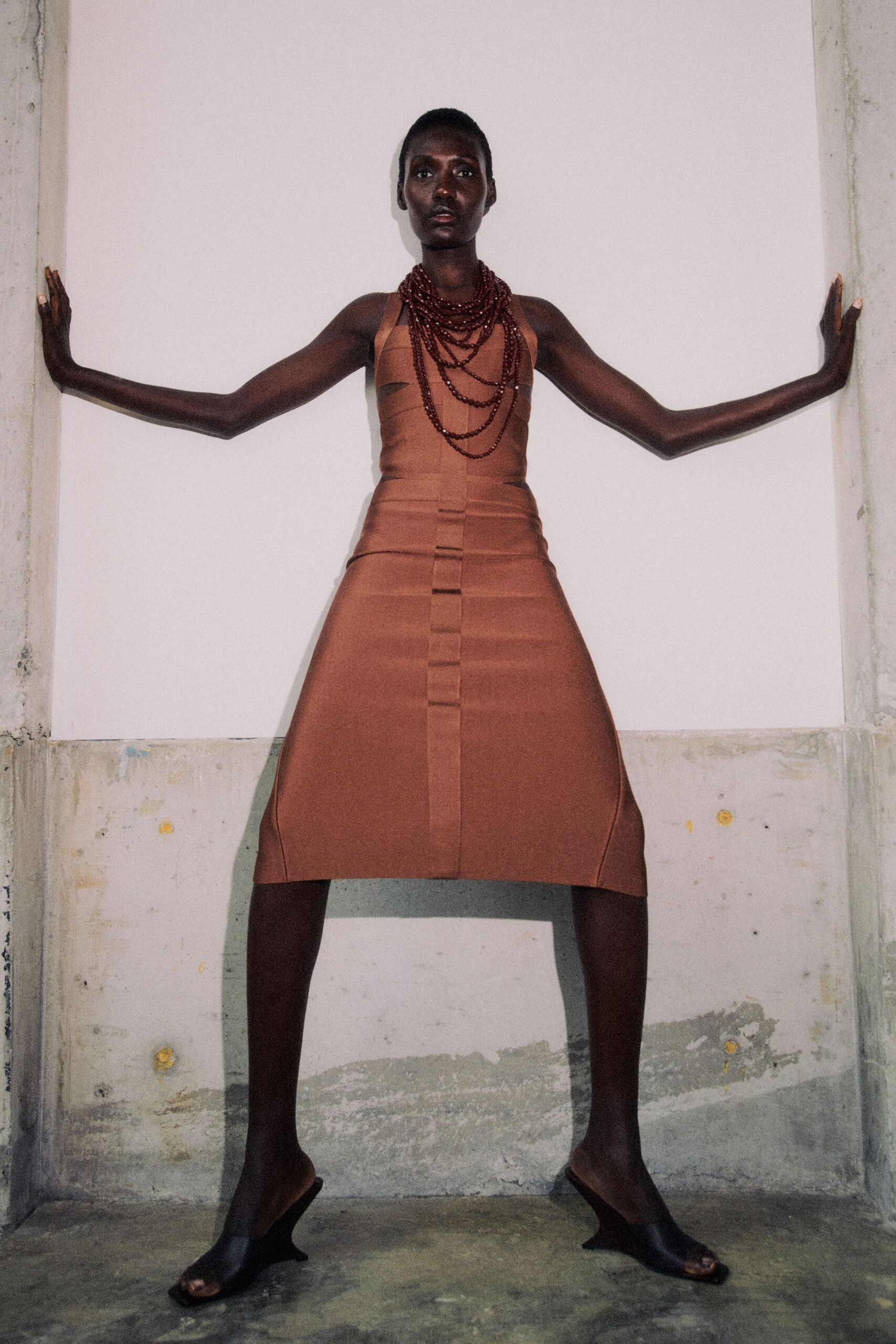 brown fitted sleeveless dress