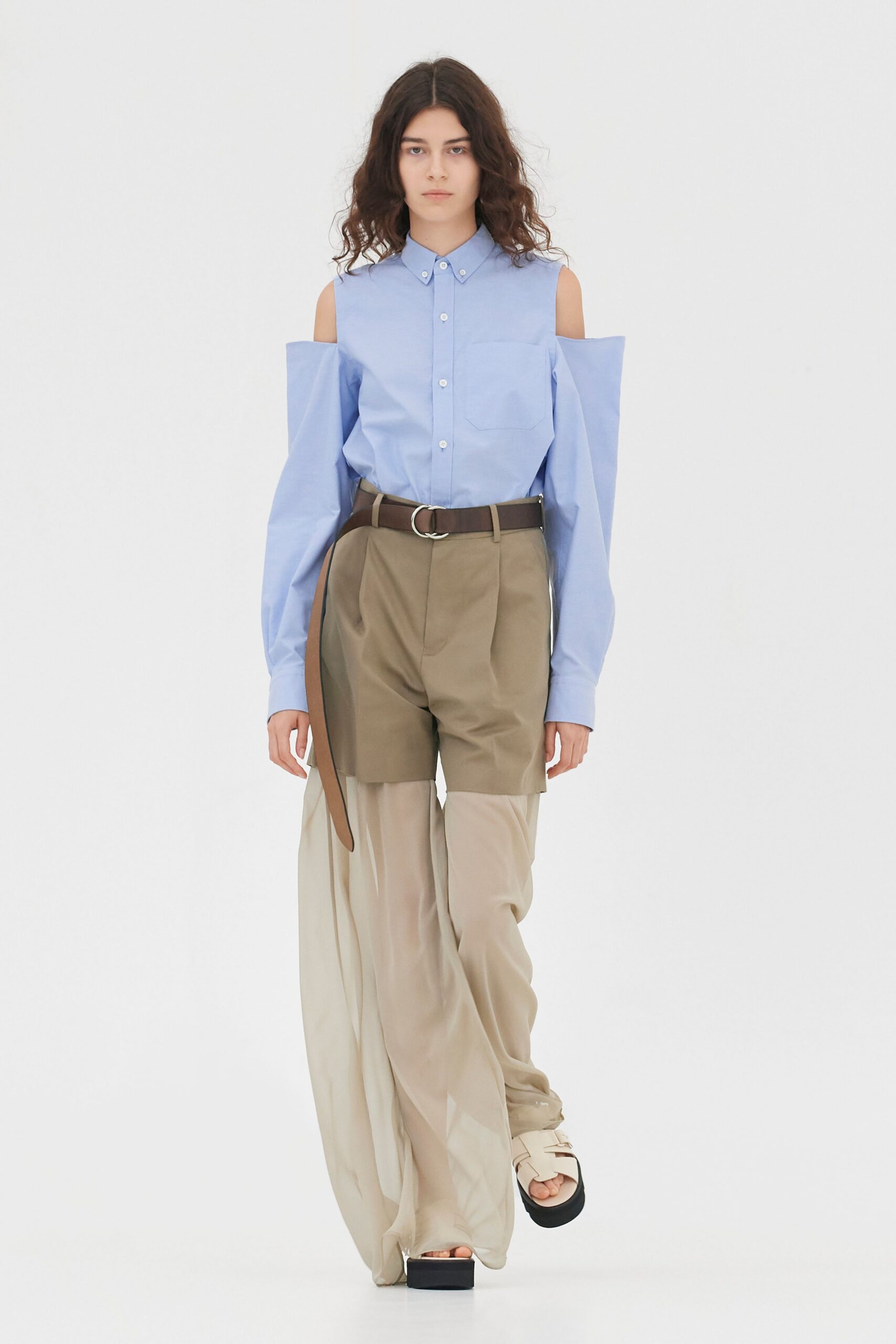 blue cutout shirt with beige pants