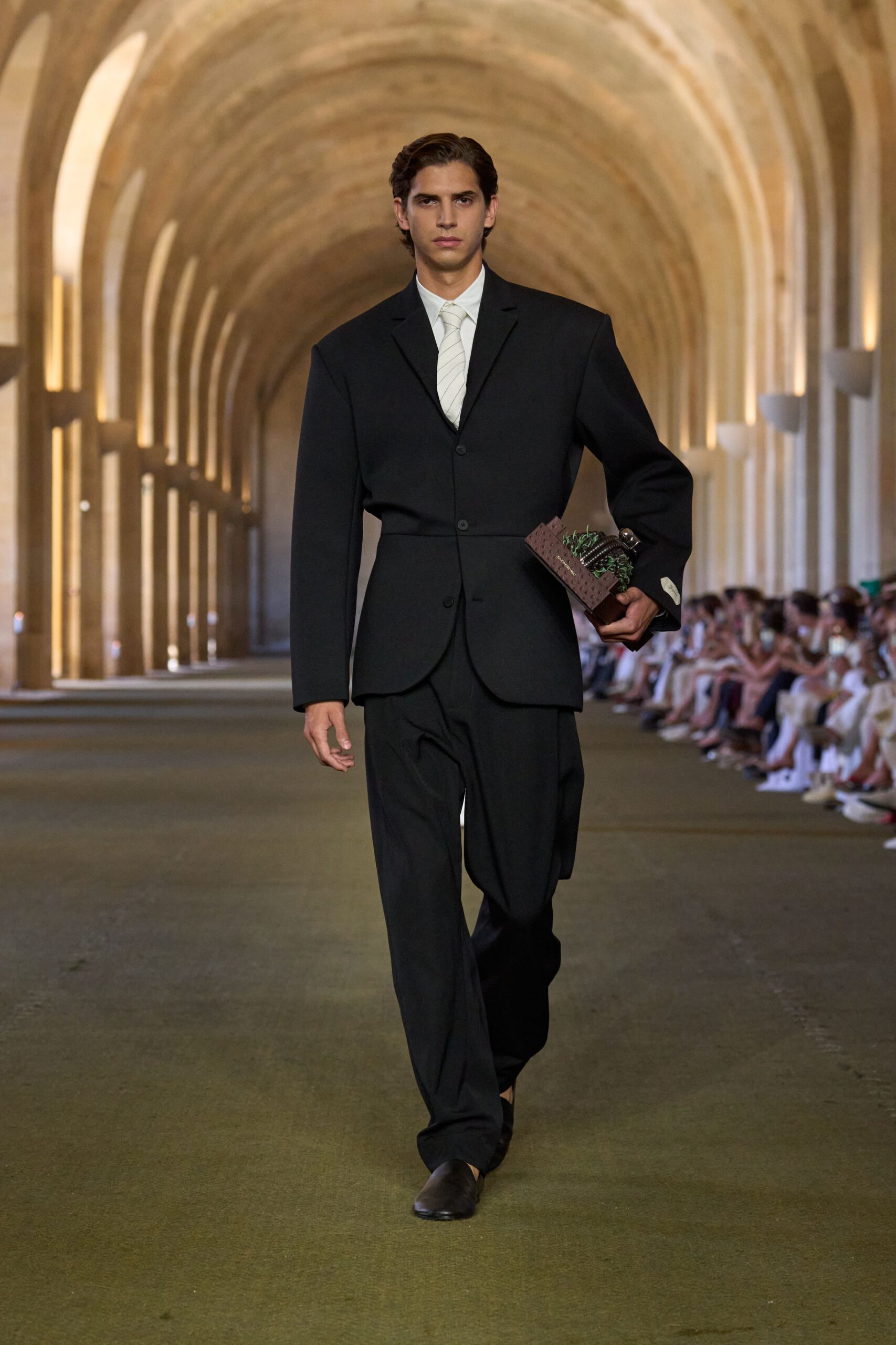 black tailored suit with bag