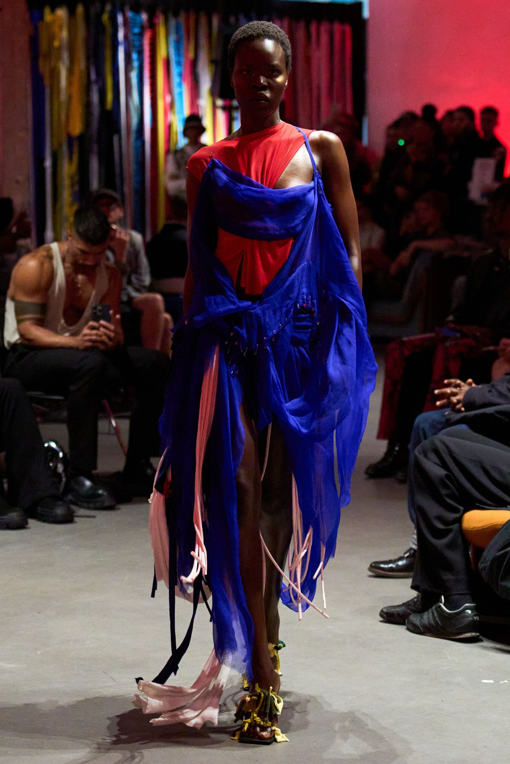 red and blue flowing dress with strappy shoes