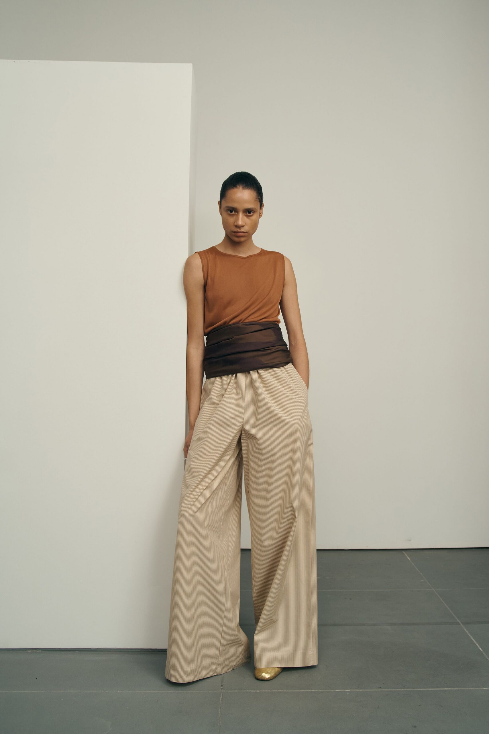 brown fitted top beige wide-leg pants
