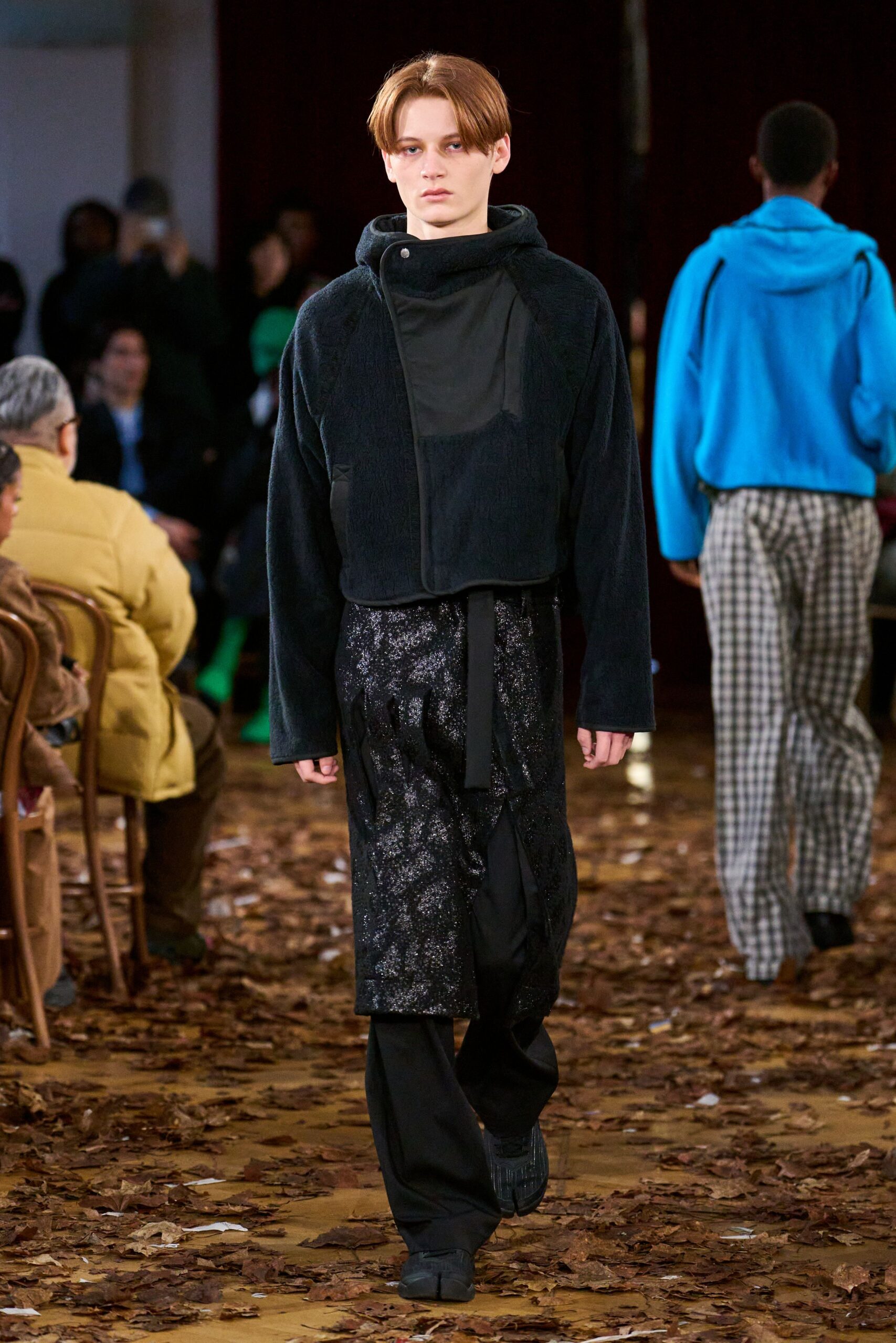 black faux-fur jacket with layered pants