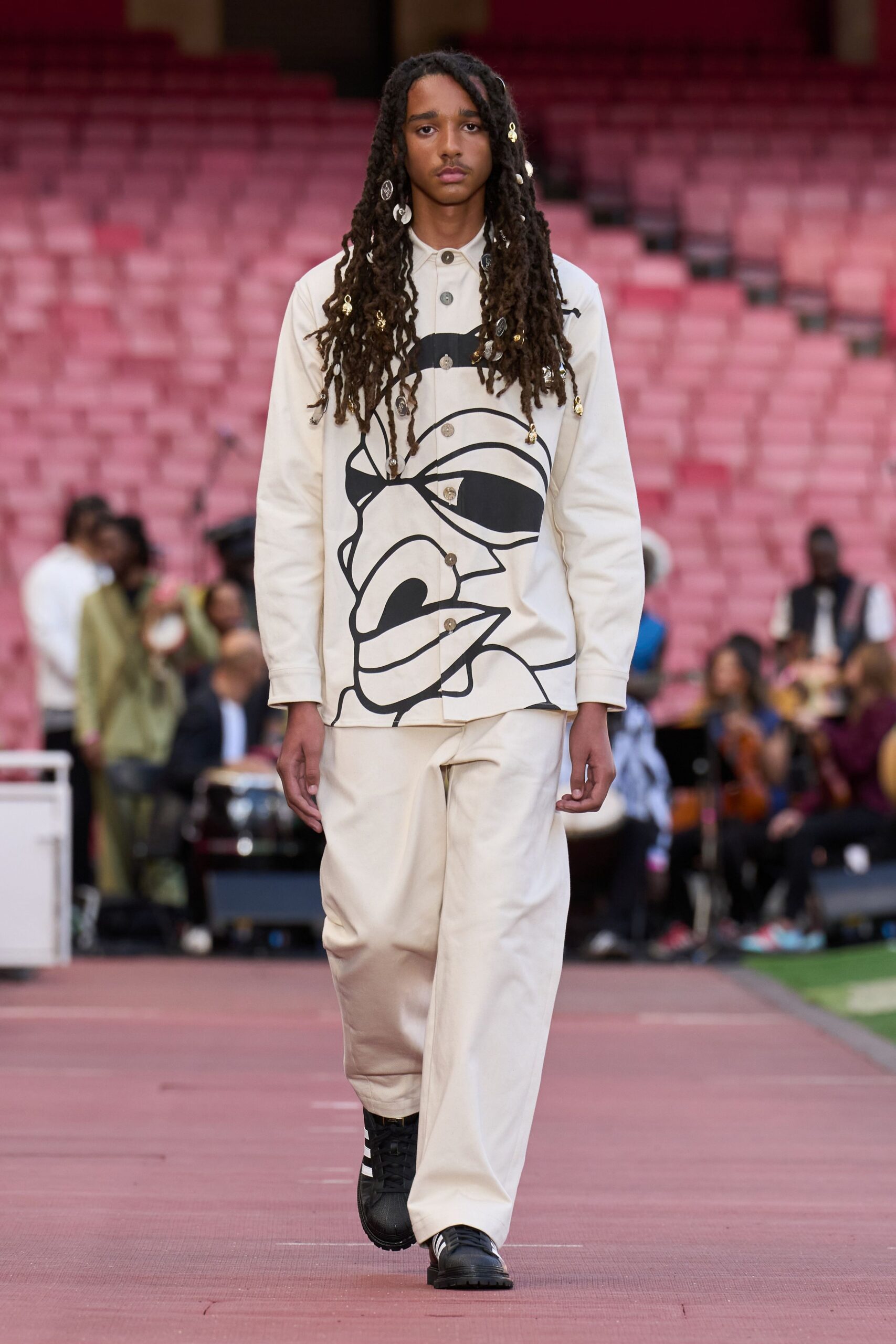 white printed shirt with beige pants