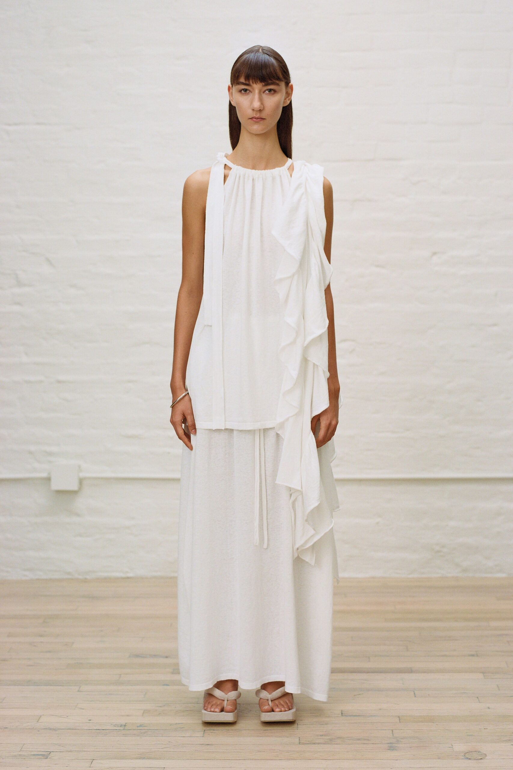 white ruffled maxi dress with platform shoes