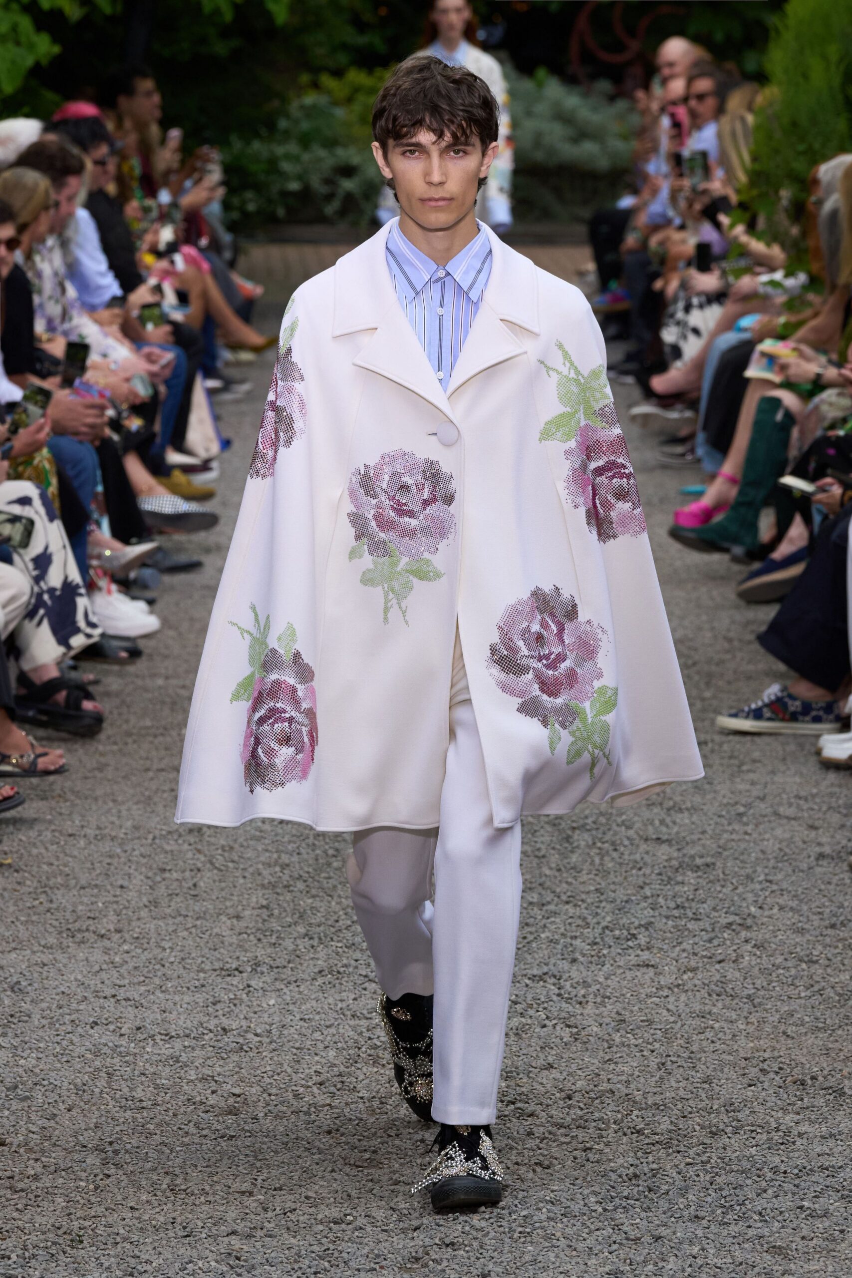 white embroidered cape with blue shirt